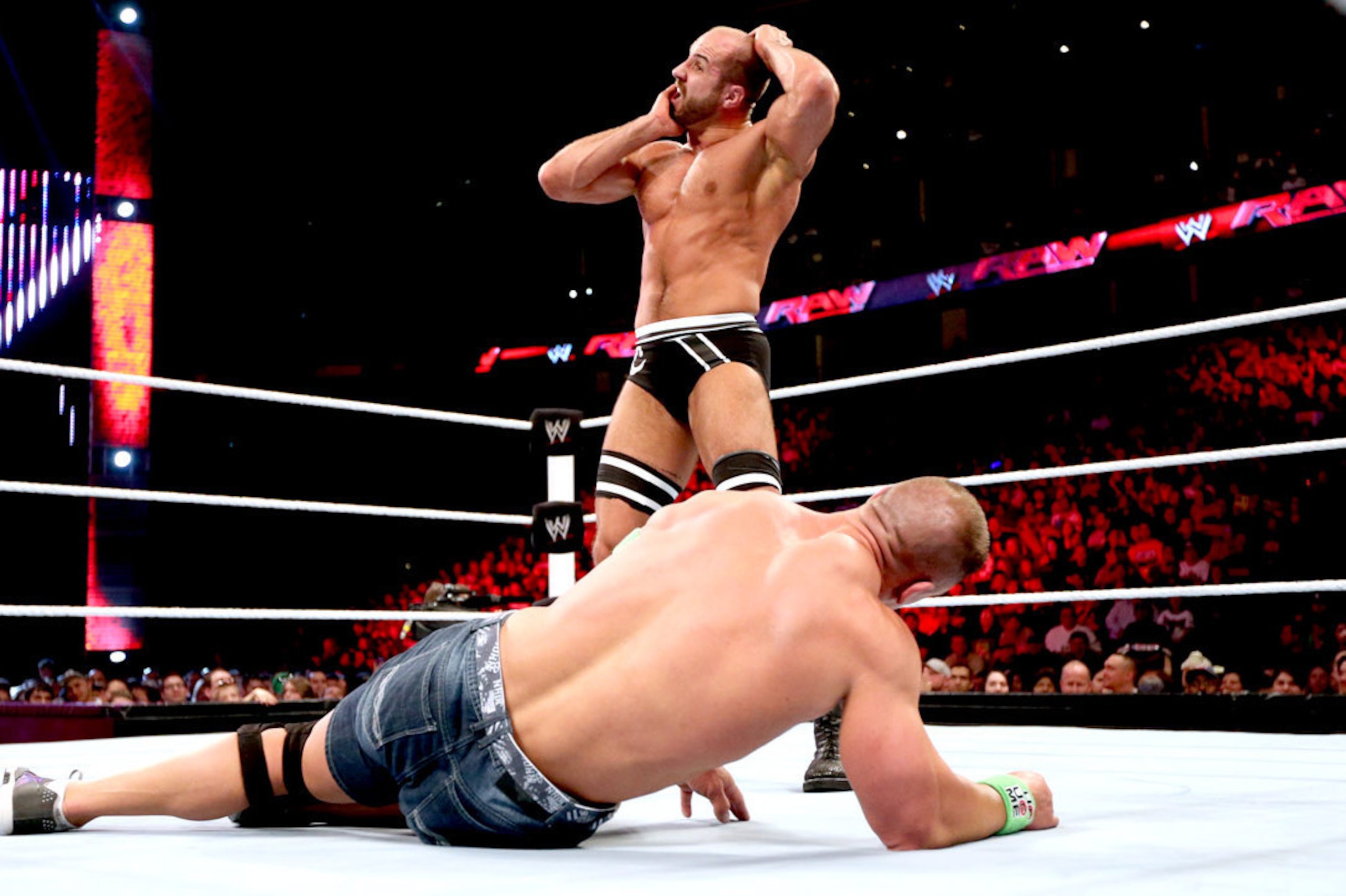 Cesaro battles John Cena.