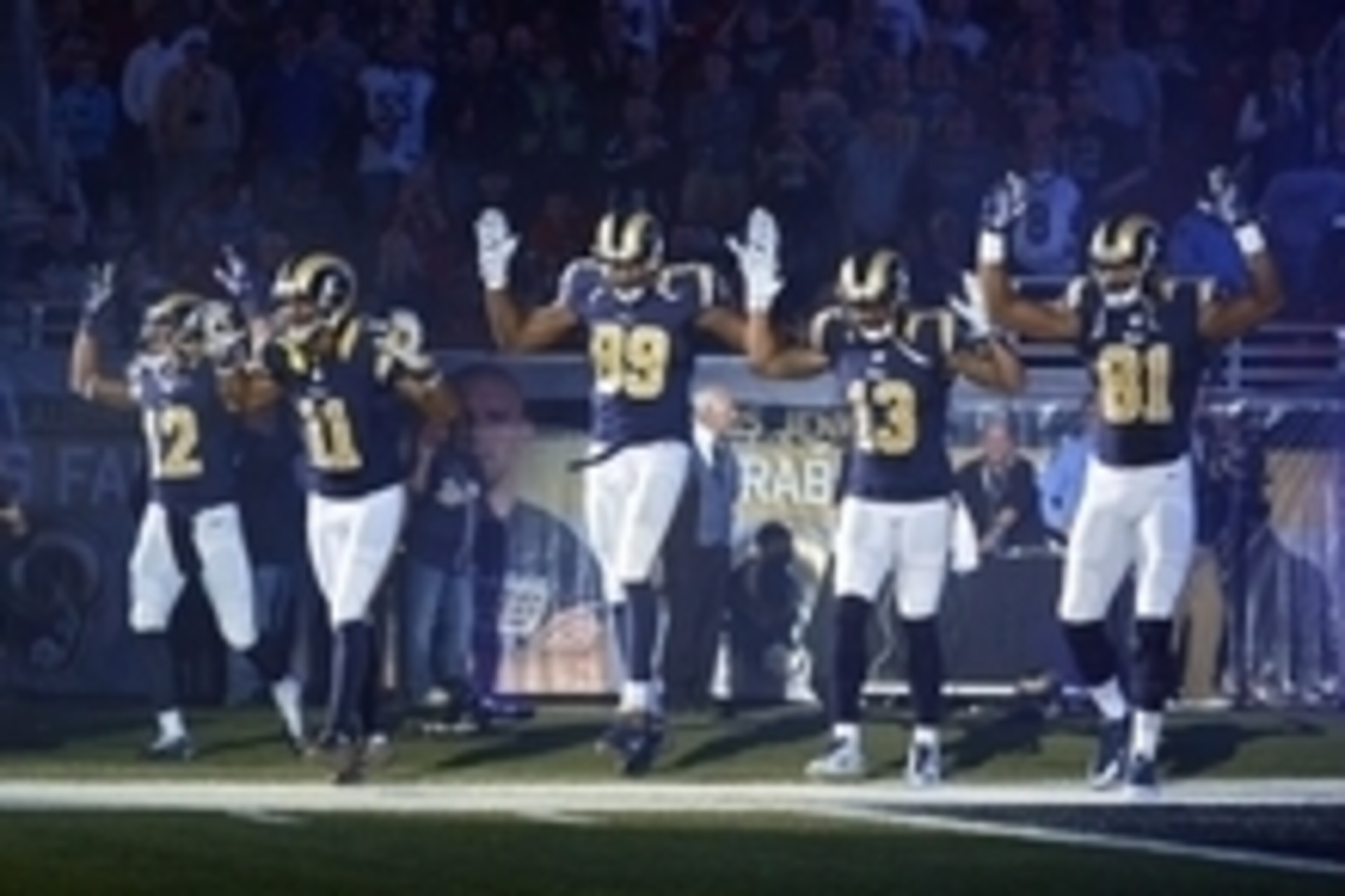 Nov 30, 2014; St. Louis, MO, USA; St. Louis Rams wide receiver Stedman Bailey (12) and wide receiver Tavon Austin (11) and tight end Jared Cook (89) and wide receiver Chris Givens (13) and wide receiver Kenny Britt (81) put their hands up to show support 
