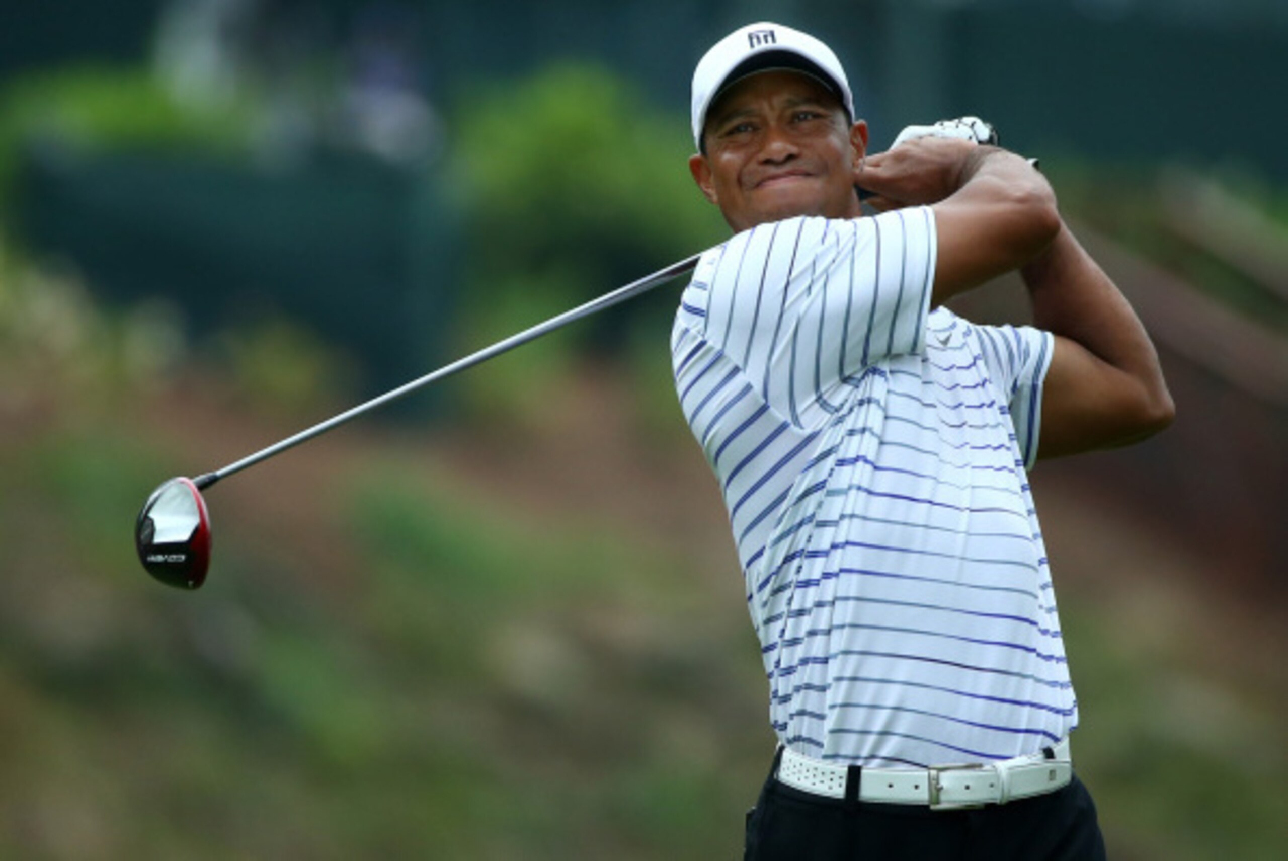 LOUISVILLE, KY - AUGUST 08:  Tiger Woods of the United States hits his tee shot on the 15th hole during the second round of the 96th PGA Championship at Valhalla Golf Club on August 8, 2014 in Louisville, Kentucky.  (Photo by Andy Lyons/Getty Images)