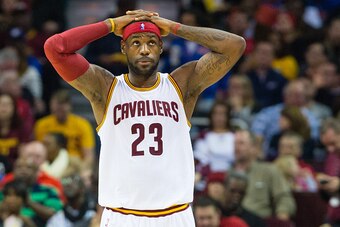 CLEVELAND, OH - NOVEMBER 22: LeBron James #23 of the Cleveland Cavaliers reacts during the first half against the Toronto Raptors at Quicken Loans Arena on November 22, 2014 in Cleveland, Ohio. NOTE TO USER: User expressly acknowledges and agrees that, by