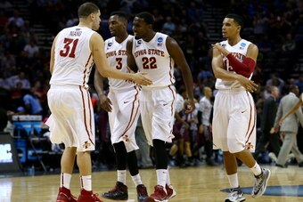 SAN ANTONIO, TX - MARCH 21: Georges Niang #31, Melvin Ejim #3, Dustin Hogue #22 and Naz Long #15 of the Iowa State Cyclones celebrate during the first half against the North Carolina Central Eagles during the second round of the 2014 NCAA Men's Basketball