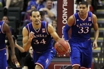 Nov 27, 2014; Kissimmee, FL, USA; Kansas Jayhawks forward Perry Ellis (34) dribbles the ball against the Rhode Island Rams during the first half at HP Field house at Wide World of Sports Complex. Mandatory Credit: Kim Klement-USA TODAY Sports