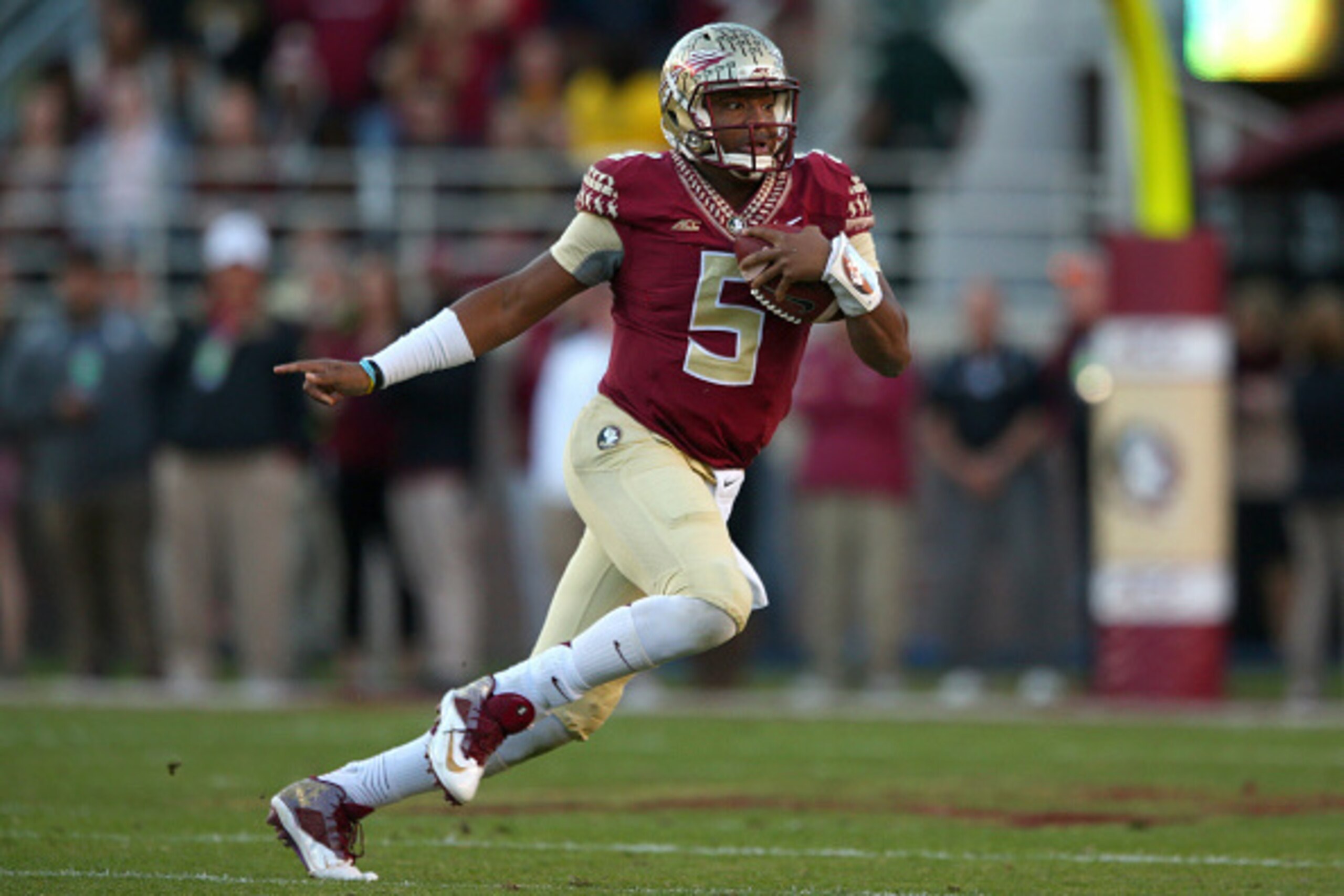 TALLAHASSEE, FL - NOVEMBER 29:  Jameis Winston #5 of the Florida State Seminoles looks turnover pass during  a game against the Florida Gators  at Doak Campbell Stadium on November 29, 2014 in Tallahassee, Florida.  (Photo by Mike Ehrmann/Getty Images)