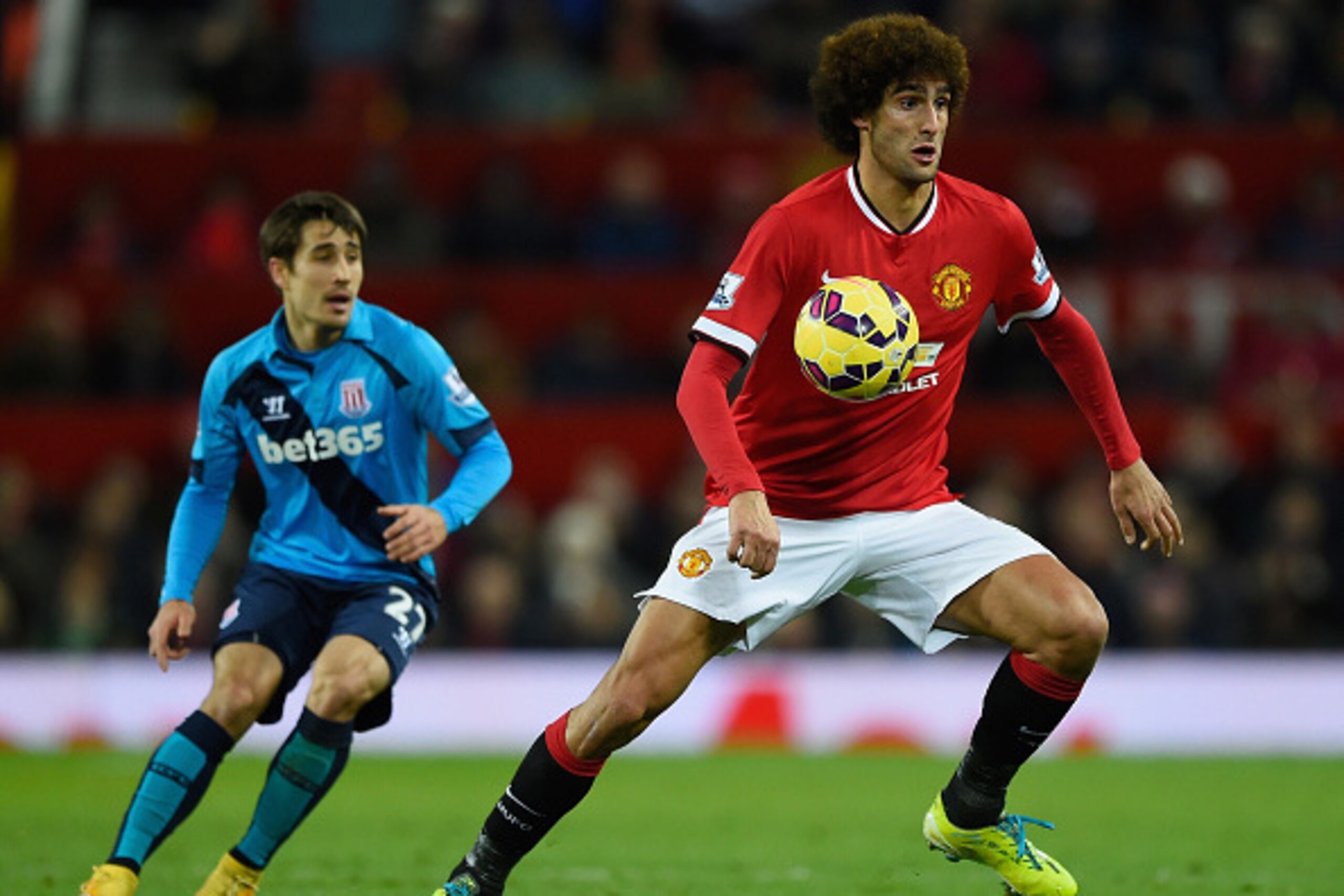 MANCHESTER, ENGLAND - DECEMBER 02:  Marouane Fellaini of Manchester United in action during the Barclays Premier League match between Manchester United and Stoke City at Old Trafford on December 2, 2014 in Manchester, England.  (Photo by Mike Hewitt/Getty