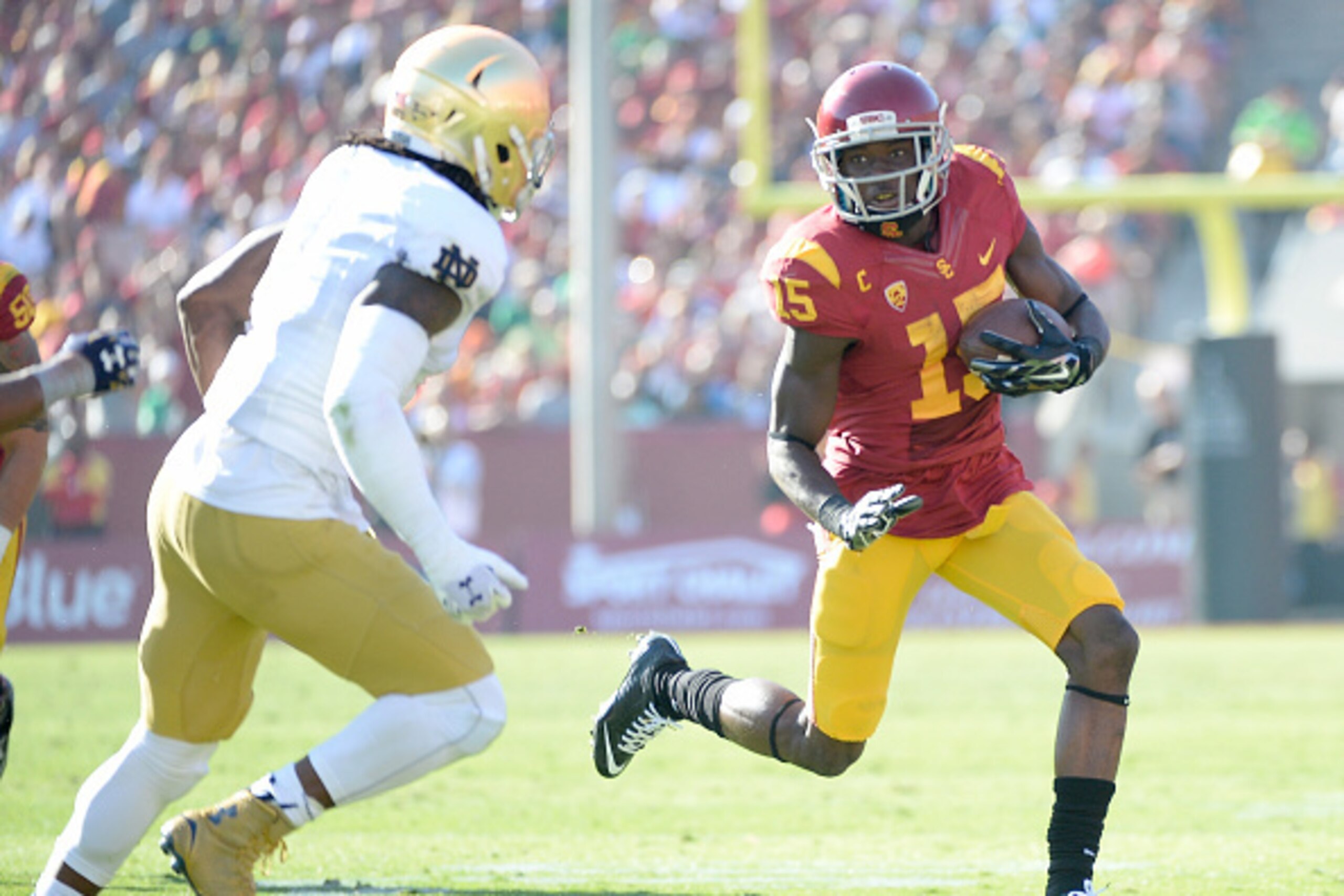 LOS ANGELES, CA - NOVEMBER 29:  Nelson Agholor #15 of the USC Trojans 5at runs after his catch in front of Jaylon Smith #9 of the Notre Dame Fighting Irish Los Angeles Memorial Coliseum on November 29, 2014 in Los Angeles, California.  (Photo by Harry How