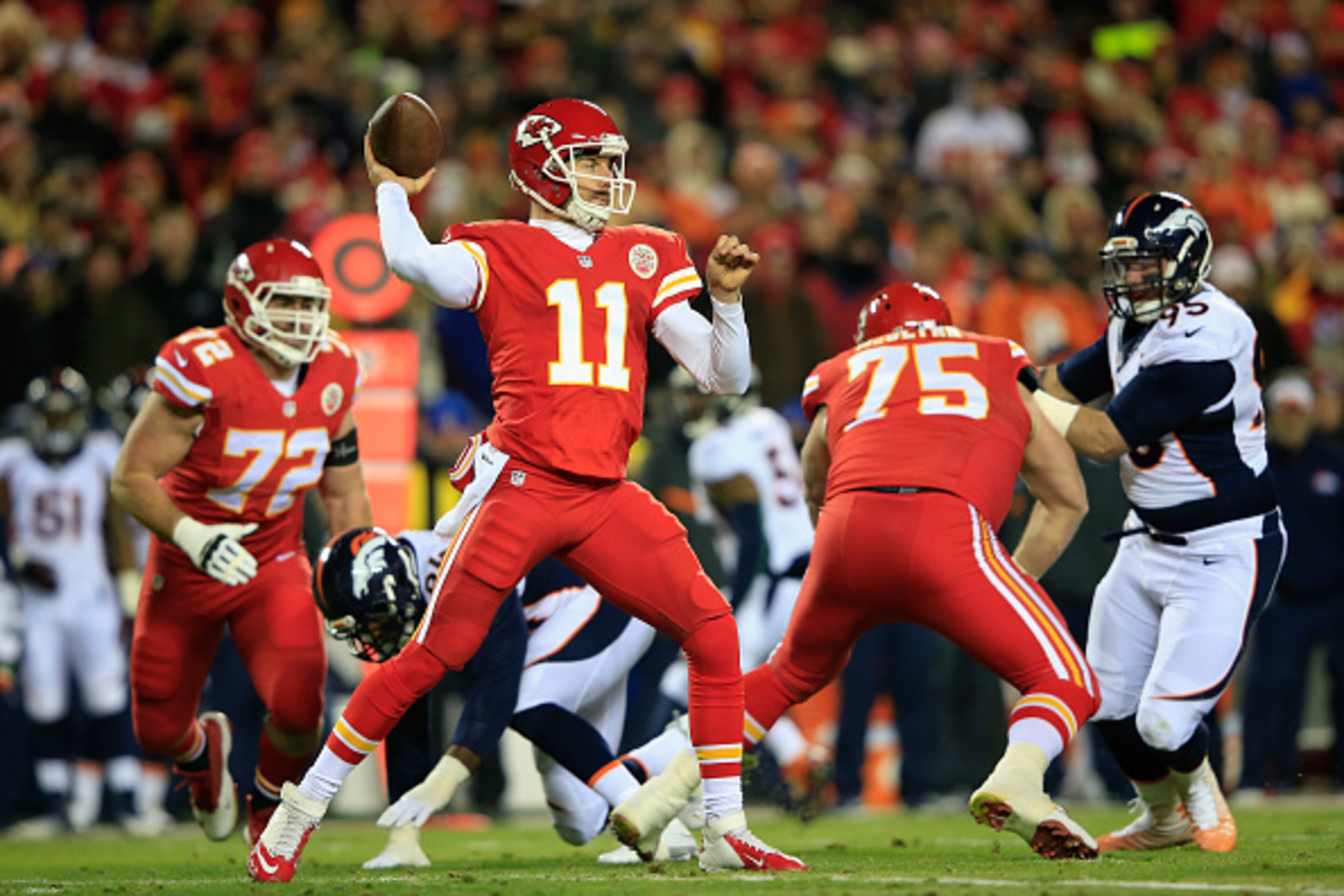 KANSAS CITY, MO - NOVEMBER 30:   Alex Smith #11 of the Kansas City Chiefs passes against the Denver Broncos during the first quater at Arrowhead Stadium on November 30, 2014 in Kansas City, Missouri.  (Photo by Jamie Squire/Getty Images)