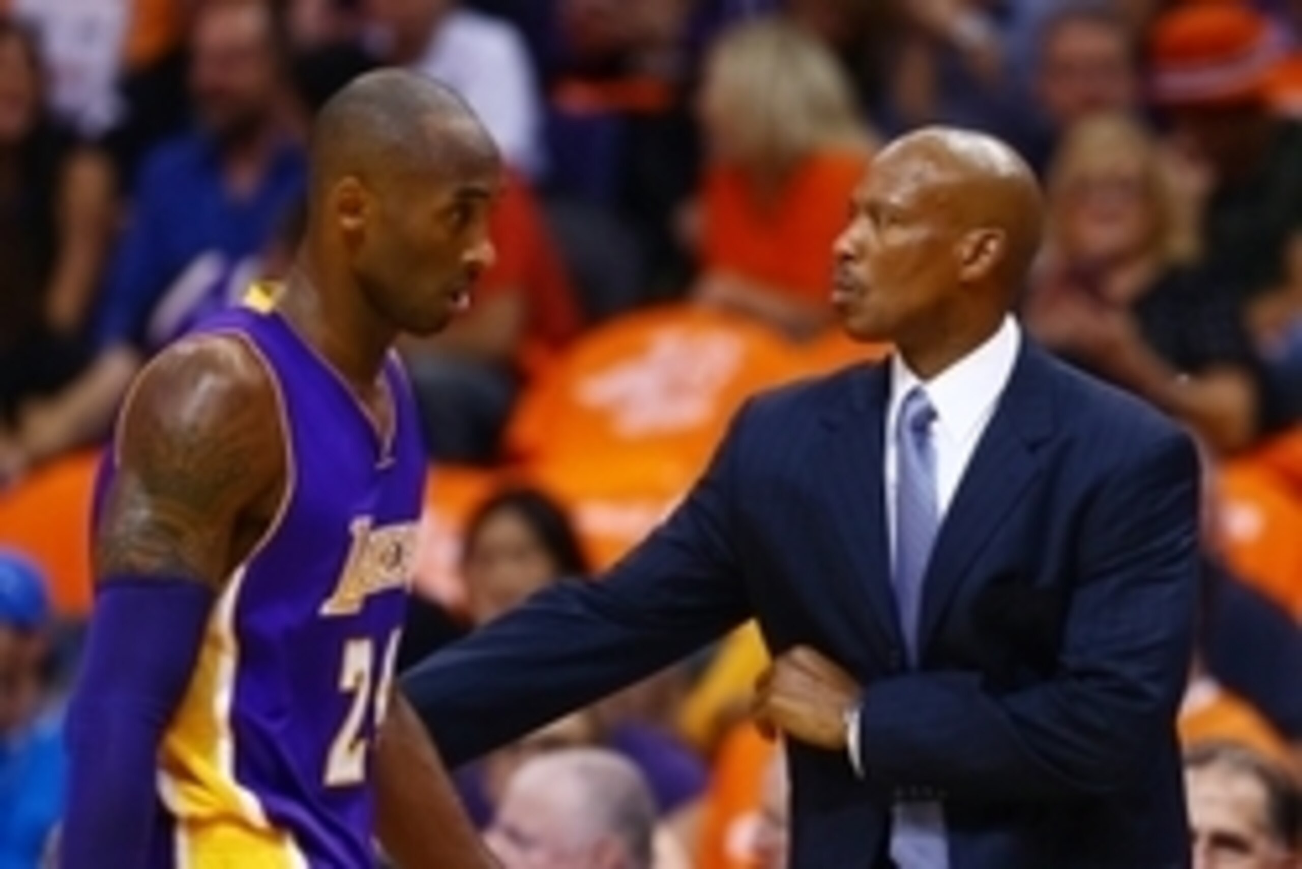 Oct 29, 2014; Phoenix, AZ, USA; Los Angeles Lakers head coach Byron Scott (right) with guard Kobe Bryant in the first half against the Phoenix Suns during the home opener at US Airways Center. The Suns defeated the Lakers 119-99. Mandatory Credit: Mark J.