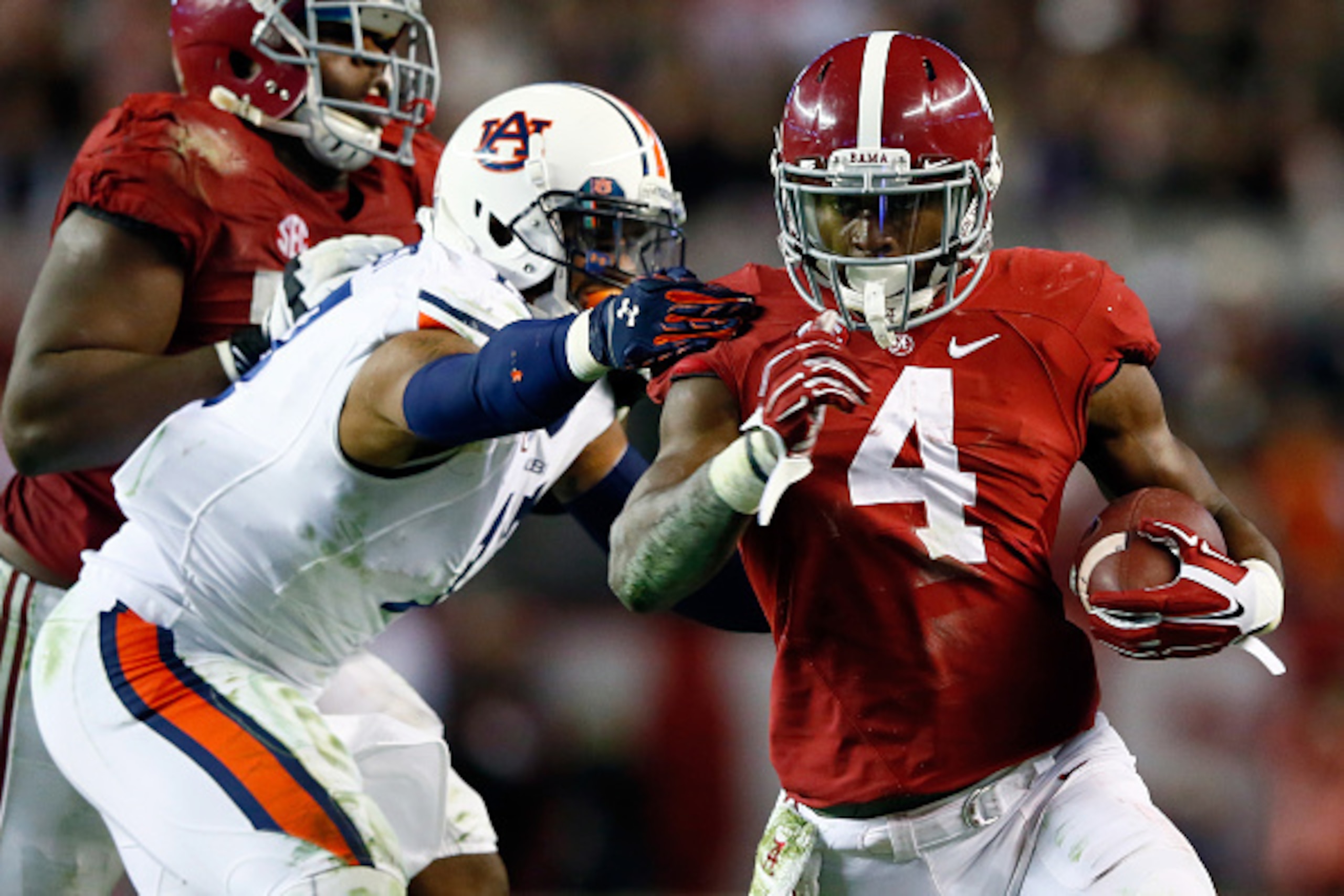 TUSCALOOSA, AL - NOVEMBER 29:  T.J. Yeldon #4 of the Alabama Crimson Tide runs the ball in the fourth quarter against the Auburn Tigers during the Iron Bowl at Bryant-Denny Stadium on November 29, 2014 in Tuscaloosa, Alabama.  (Photo by Kevin C. Cox/Getty