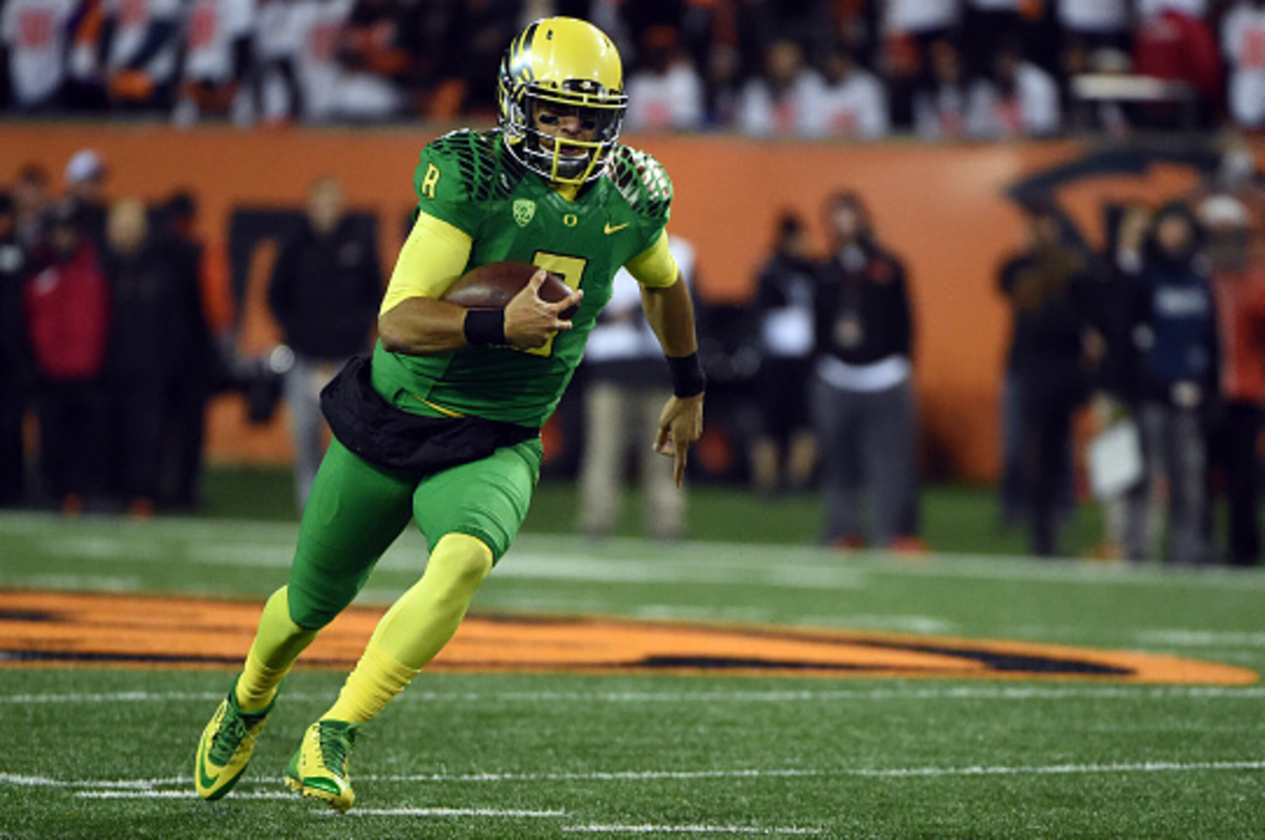 CORVALLIS, OR - NOVEMBER 29: Quarterback Marcus Mariota #8 of the Oregon Ducks runs with the ball during the third quarter of the game against the Oregon State Beavers at Reser Stadium on November 29, 2014 in Corvallis, Oregon. (Photo by Steve Dykes/Getty
