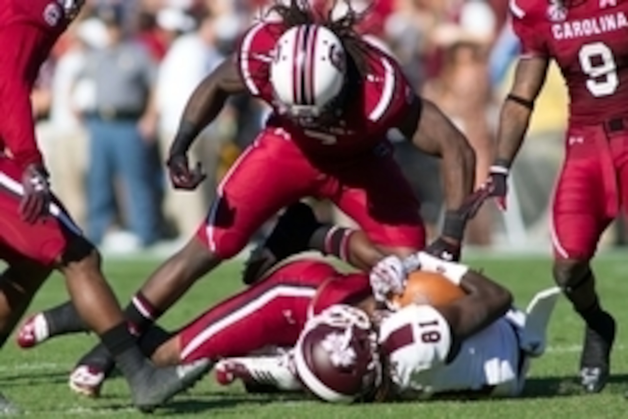 Nov 2, 2013; Columbia, SC, USA; South Carolina Gamecocks defensive end Jadeveon Clowney (7) tackles Mississippi State Bulldogs wide receiver De'Runnya Wilson (81) during the fourth quarter at Williams-Brice Stadium. The Gamecocks defeated the Bulldogs 34- Nov 2, 2013; Columbia, SC, USA; South Carolina Gamecocks defensive end Jadeveon Clowney (7) tackles Mississippi State Bulldogs wide receiver De'Runnya Wilson (81) during the fourth quarter at Williams-Brice Stadium. The Gamecocks defeated the Bulldogs 34-