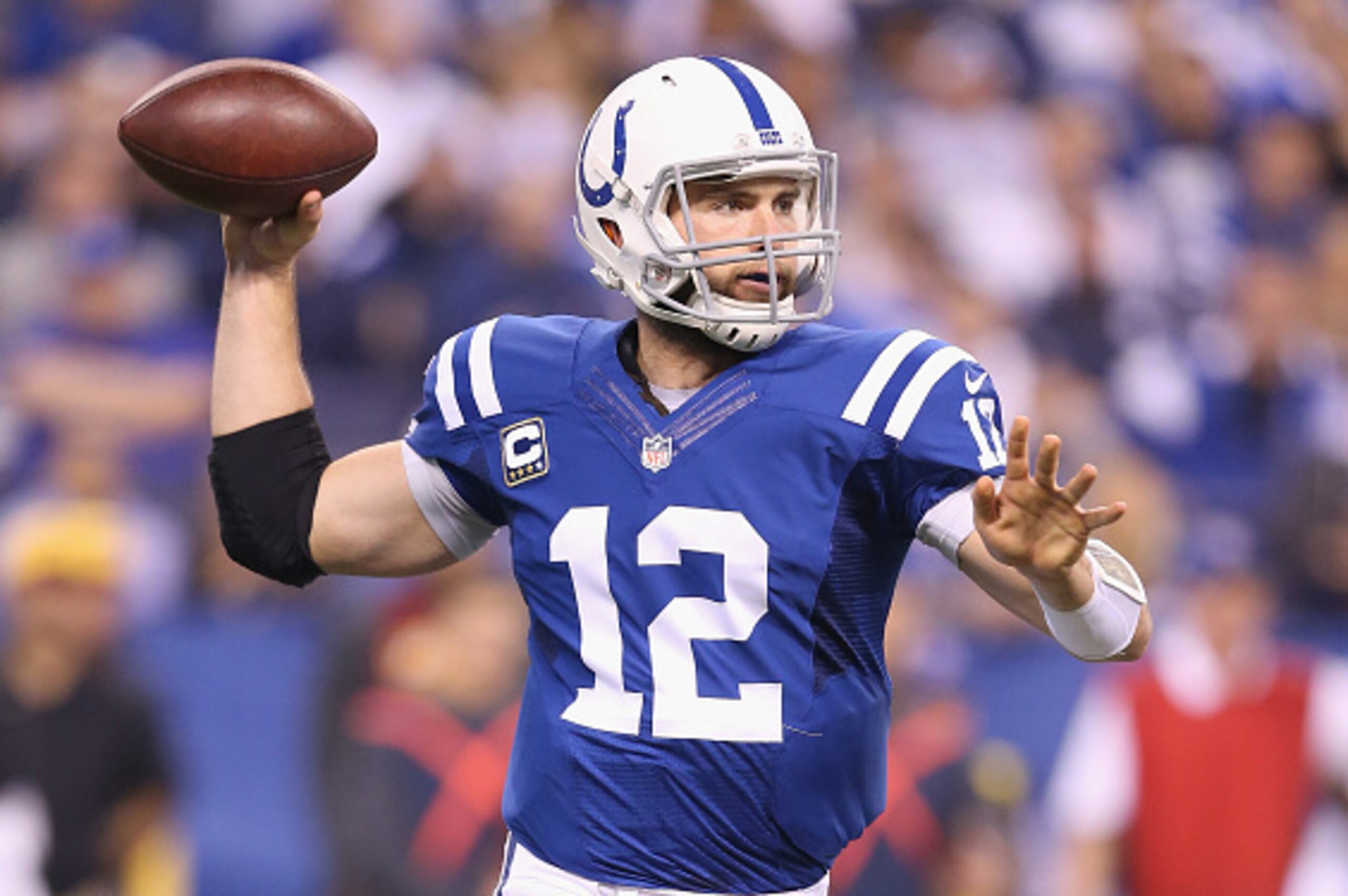 INDIANAPOLIS, IN - NOVEMBER 30:  Andrew Luck #12 of the Indianapolis Colts throws a pass during the game against the Washington Redskins at Lucas Oil Stadium on November 30, 2014 in Indianapolis, Indiana.  (Photo by Andy Lyons/Getty Images)