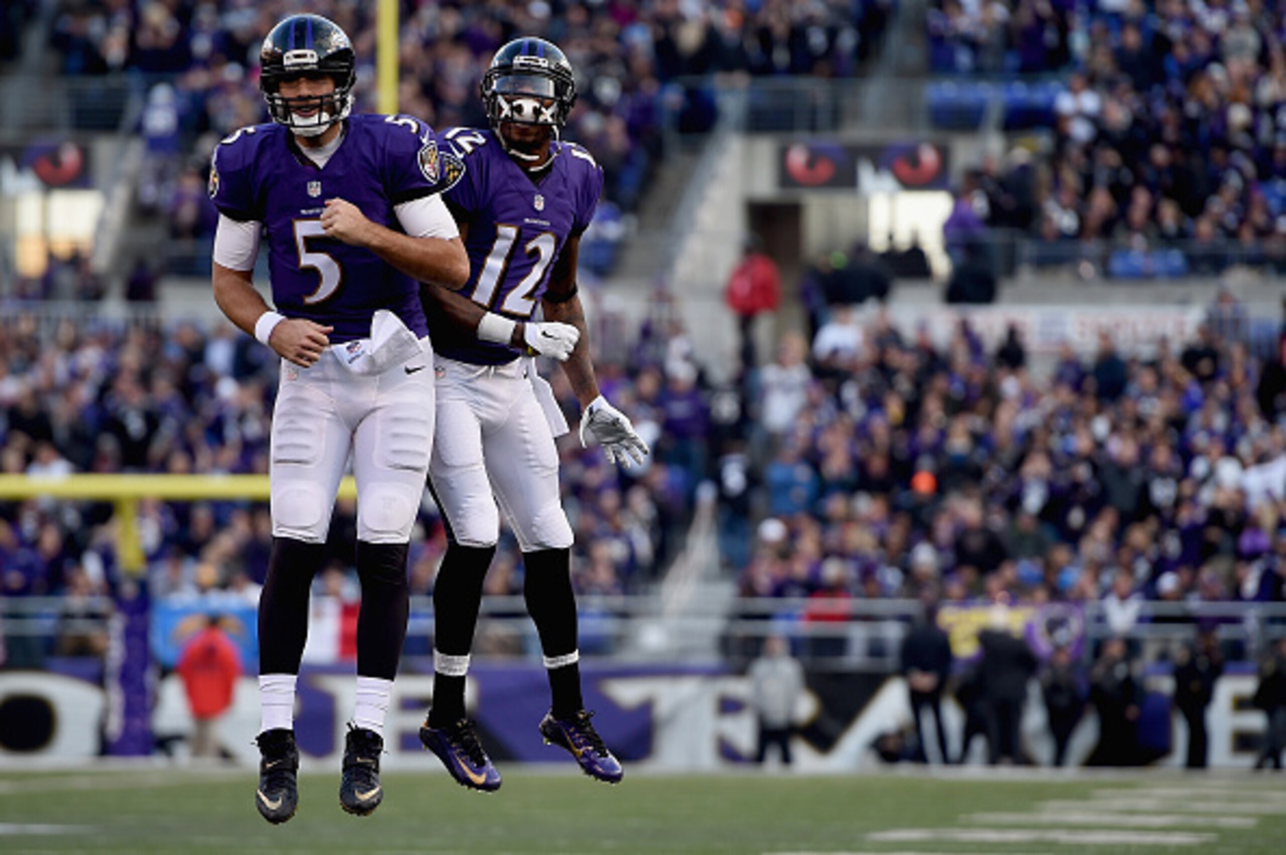 BALTIMORE, MD - NOVEMBER 30: Quarterback Joe Flacco #5 of the Baltimore Ravens and wide receiver Jacoby Jones #12 celebrate after Flaccos' fourth quarter touchdown against the San Diego Chargers at M&T Bank Stadium on November 30, 2014 in Baltimore, Maryl