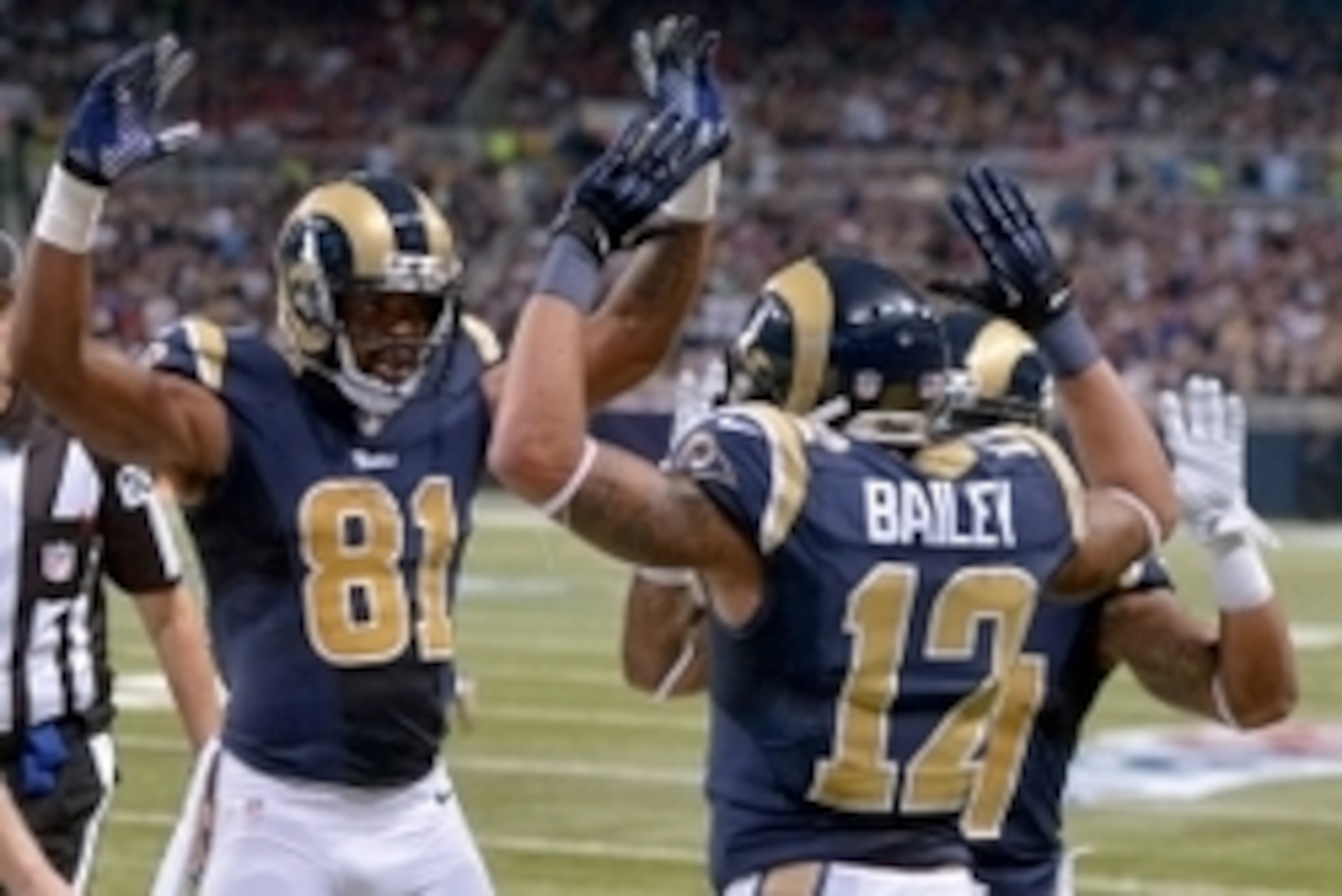 Nov 30, 2014; St. Louis, MO, USA; St. Louis Rams receivers Kenny Britt (81) and Stedman Bailey (12) celebrate in the first quarter against the Oakland Raiders at Edward Jones Dome. Mandatory Credit: Kirby Lee-USA TODAY Sports