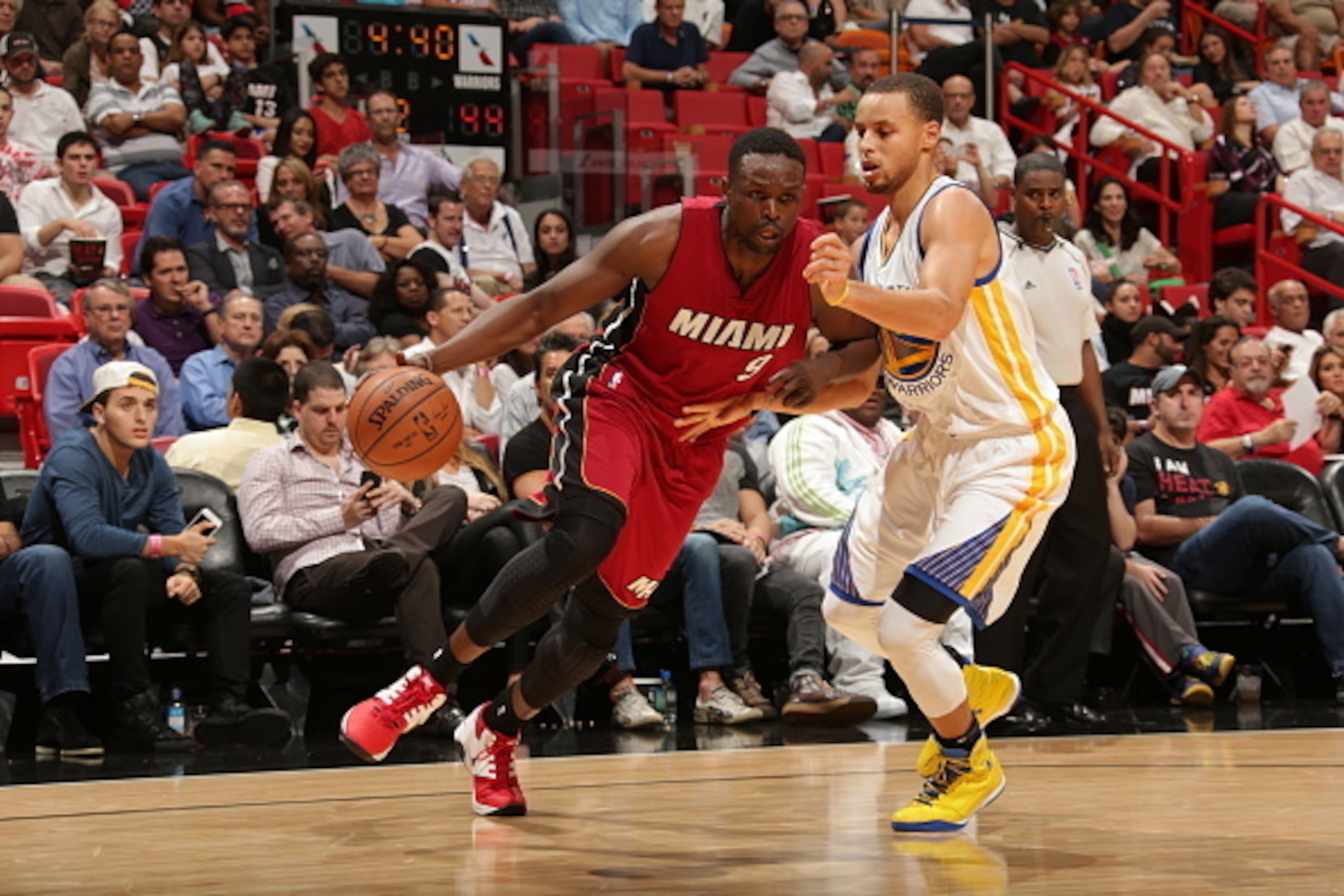 MIAMI, FL - NOVEMBER 25:  Luol Deng #9 of the Miami Heat drives to the basket against the Golden State Warriors  on November 25, 2014 at American Airlines Arena in Miami, Florida.  NOTE TO USER: User expressly acknowledges and agrees that, by downloading 