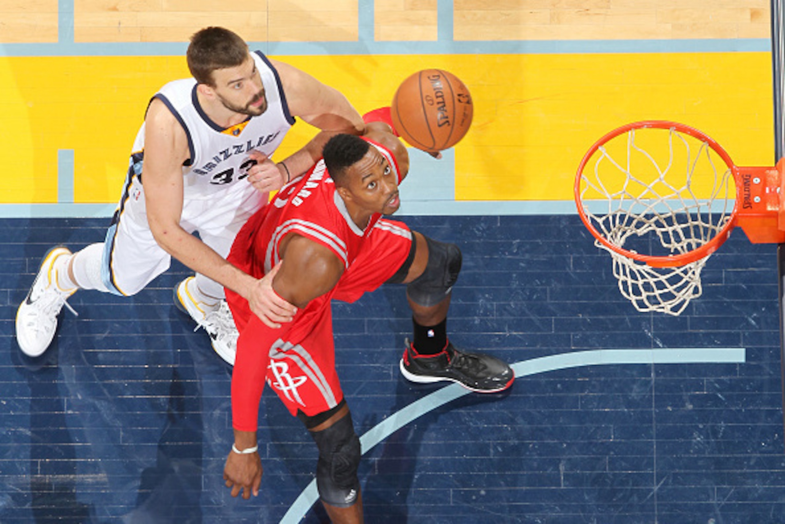 MEMPHIS, TN - NOVEMBER 17: Dwight Howard #12 of the Houston Rockets looks for the rebound against Marc Gasol #33 of the Memphis Grizzlies during the game on November 17, 2014 at FedExForum in Memphis, Tennessee. NOTE TO USER: User expressly acknowledges a