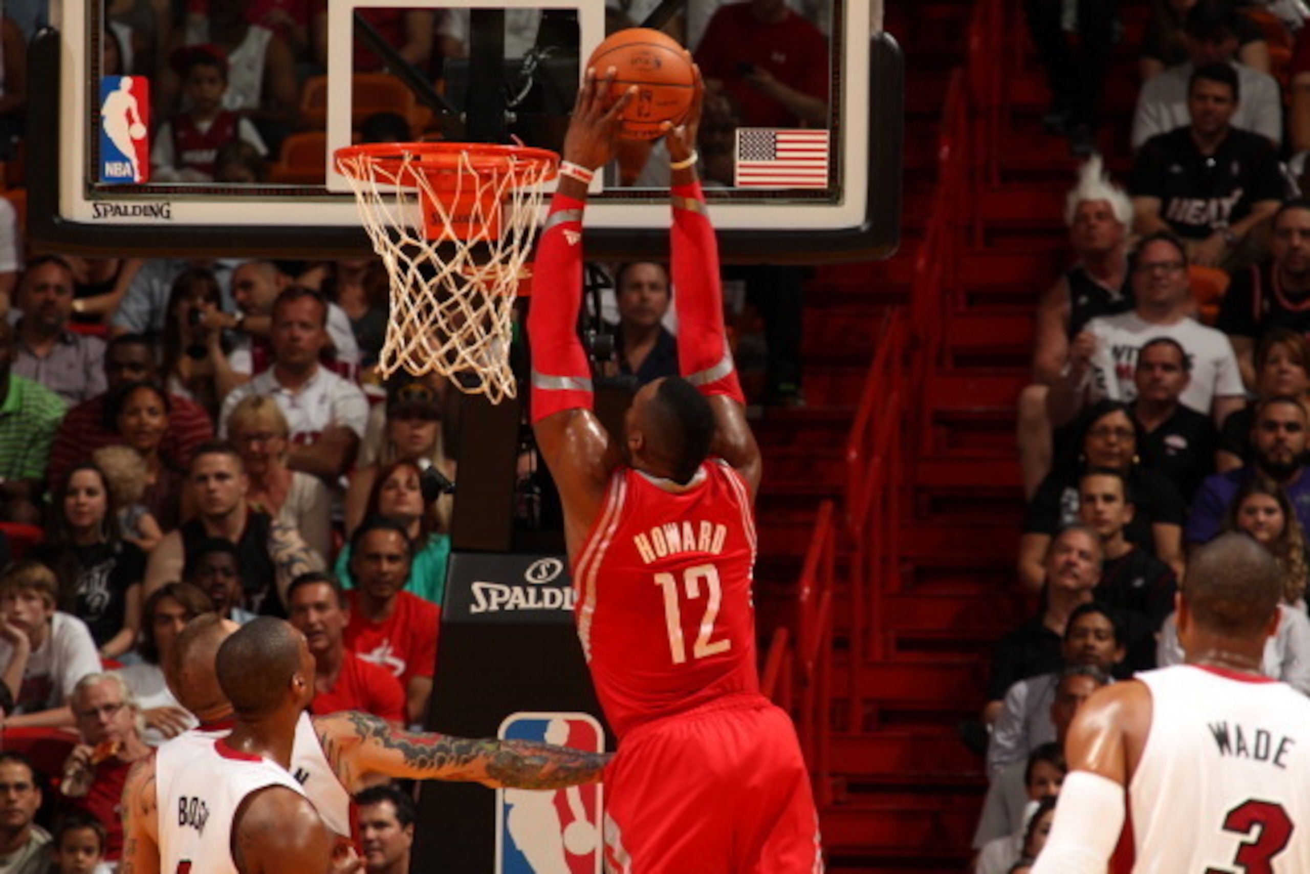 MIAMI, FL - March 16: Dwight Howard #12 of the Houston Rockets dunks the balll against the Miami Heat at the American Airlines Arena in Miami, Florida on March 16 2014. NOTE TO USER: User expressly acknowledges and agrees that, by downloading and/or using