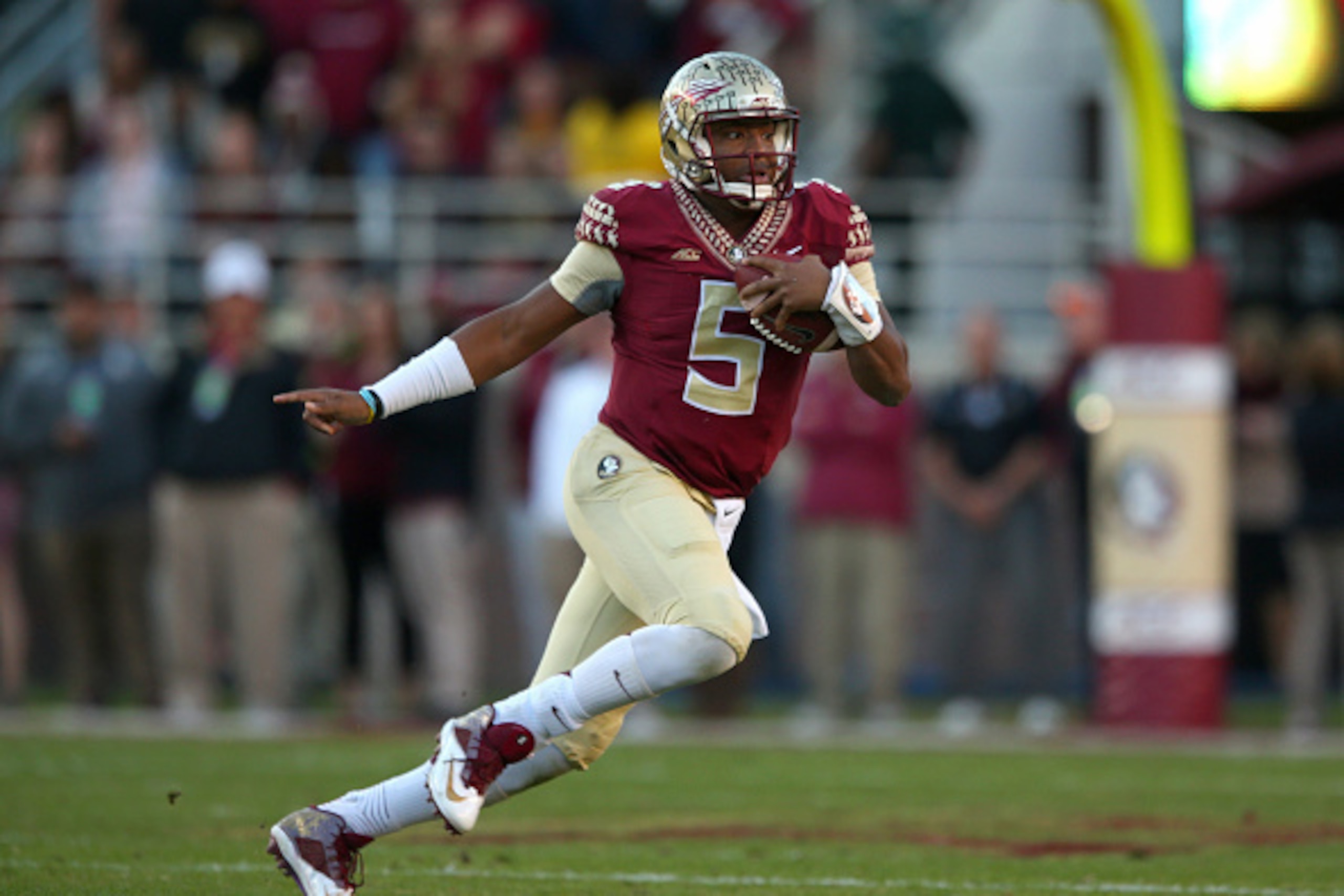 TALLAHASSEE, FL - NOVEMBER 29:  Jameis Winston #5 of the Florida State Seminoles looks turnover pass during  a game against the Florida Gators  at Doak Campbell Stadium on November 29, 2014 in Tallahassee, Florida.  (Photo by Mike Ehrmann/Getty Images)
