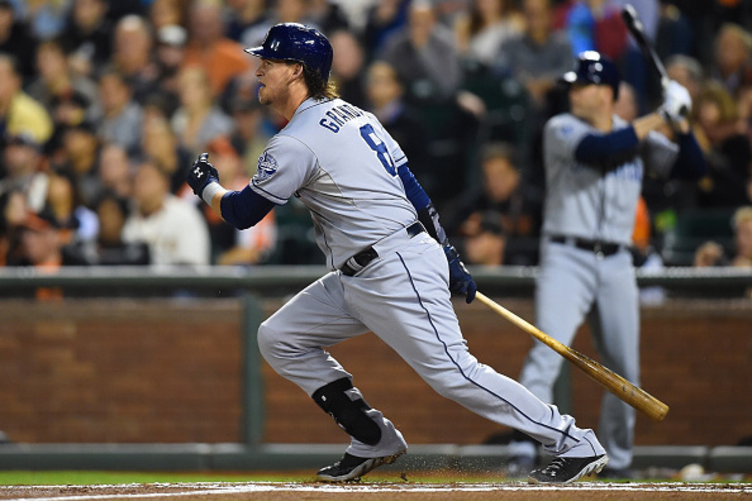 SAN FRANCISCO, CA - SEPTEMBER 26:  Yasmani Grandal #8 of the San Diego Padres hits an rbi single scoring Will Venable #25 against the San Francisco Giants in the top of the first inning at AT&T Park on September 26, 2014 in San Francisco, California.  (Ph