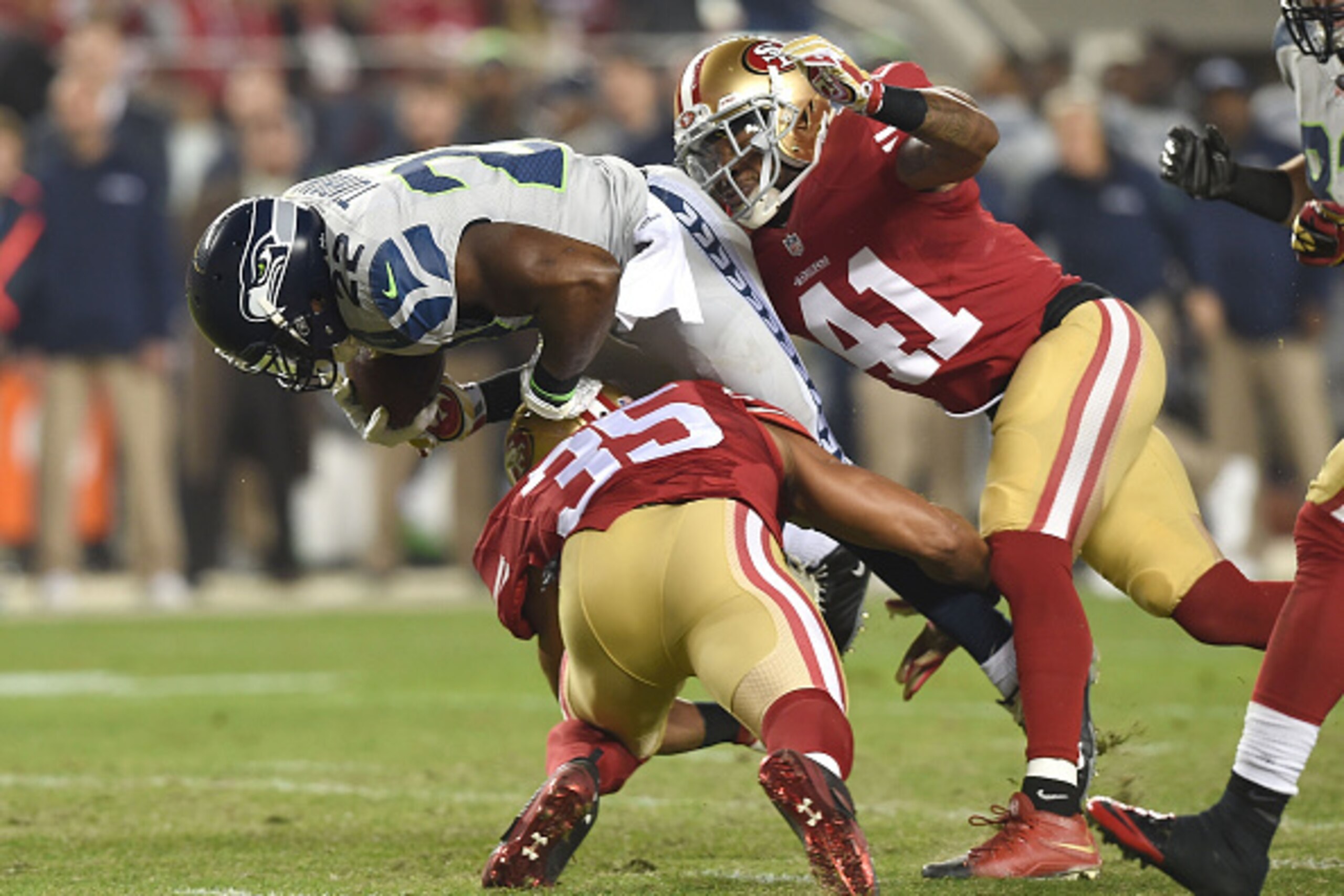 SANTA CLARA, CA - NOVEMBER 27: Robert Turbin #22 of the Seattle Seahawks goes over the top of Eric Reid #35 of the San Francisco 49ers and Antoine Bethea #41 of the San Francisco 49ers in the second quarter at Levi's Stadium on November 27, 2014 in Santa SANTA CLARA, CA - NOVEMBER 27: Robert Turbin #22 of the Seattle Seahawks goes over the top of Eric Reid #35 of the San Francisco 49ers and Antoine Bethea #41 of the San Francisco 49ers in the second quarter at Levi's Stadium on November 27, 2014 in Santa