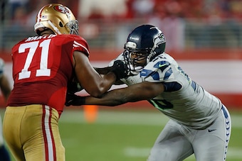 SANTA CLARA, CA - NOVEMBER 27:  Defensive tackle Chris Avril #56 of the Seattle Seahawks works around tackle Jonathan Martin #71 of the San Francisco 49ers in the fourth quarter on November 27, 2014 at Levi's Stadium in Santa Clara, California.  The Seaha