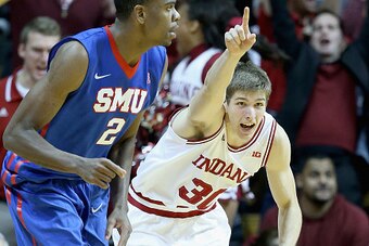BLOOMINGTON, IN - NOVEMBER 20: Colin Hartman #30 of the Indiana Hoosiers celebrates after making a three point during the game against SMU Mustangs at Assembly Hall on November 20, 2014 in Bloomington, Indiana.  Indiana won 74-68.  (Photo by Andy Lyons/Ge