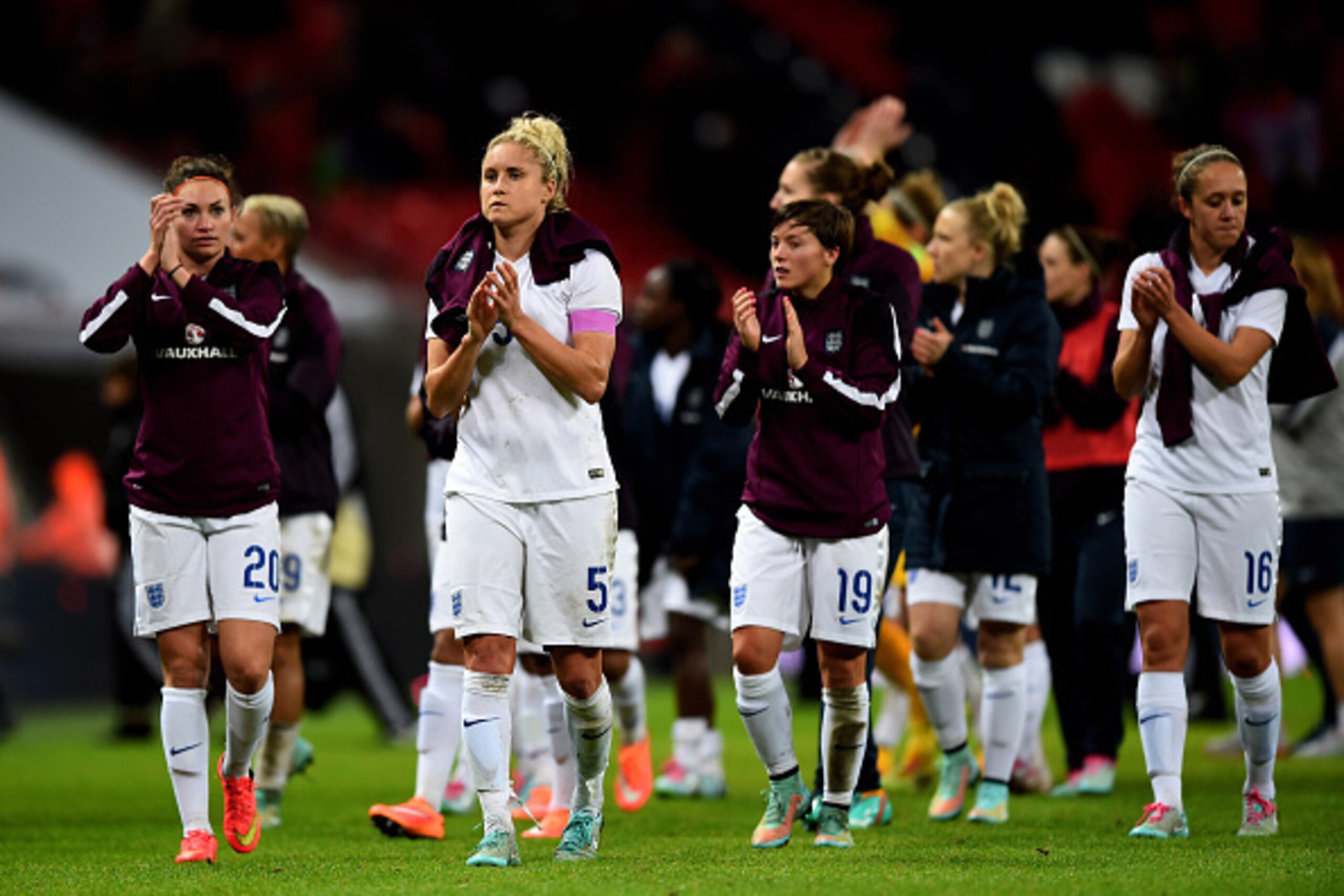 LONDON, ENGLAND - NOVEMBER 23:  Dejected England players applaud the fans following their team's 3-0 defeat during the Women's International Friendly match between England and Germany at Wembley Stadium on November 23, 2014 in London, England.  (Photo by 