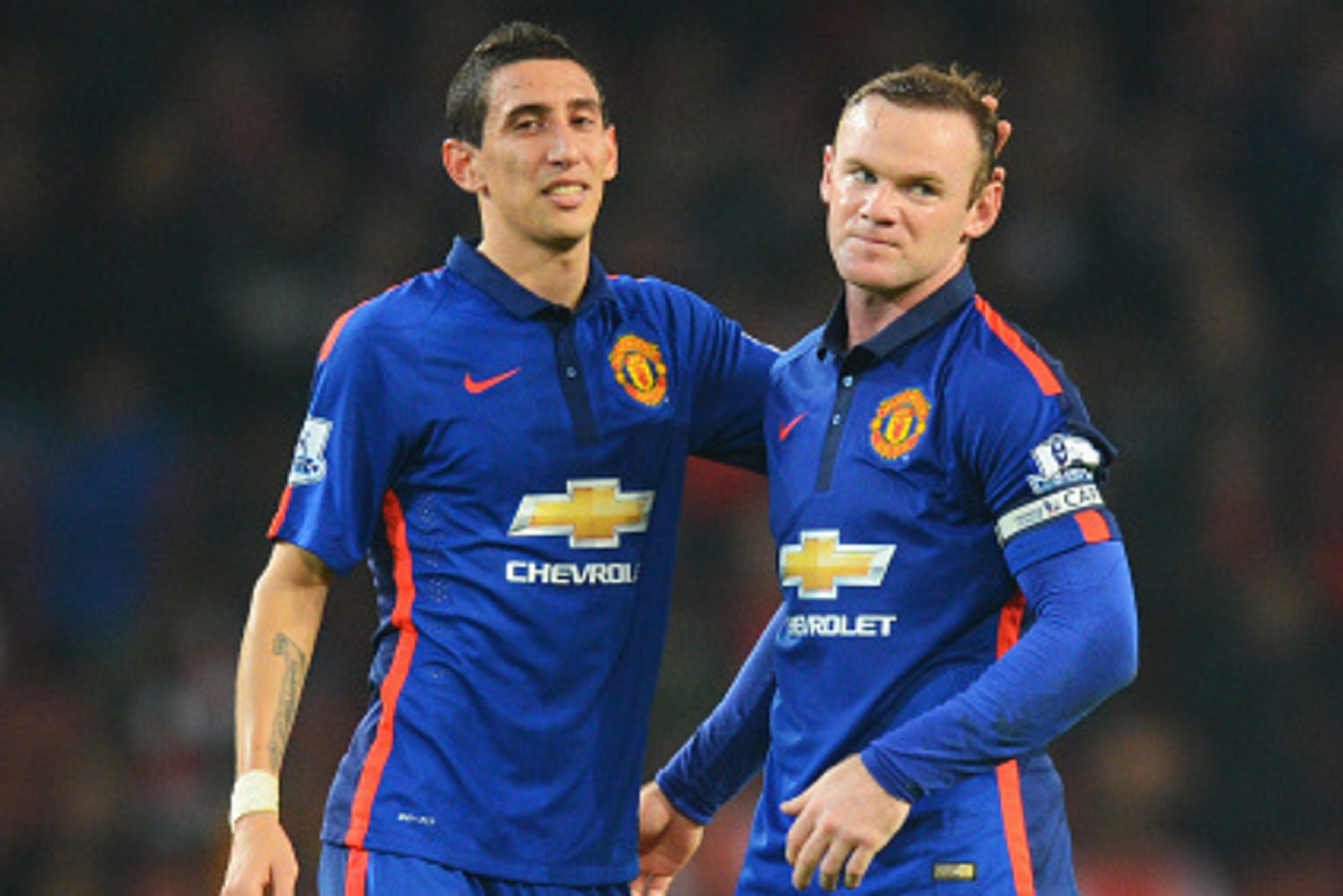 LONDON, ENGLAND - NOVEMBER 22: Angel Di Maria (L) and Wayne Rooney of Manchester United celebrate victory after the Barclays Premier League match between Arsenal and Manchester United at Emirates Stadium on November 22, 2014 in London, England.  (Photo by