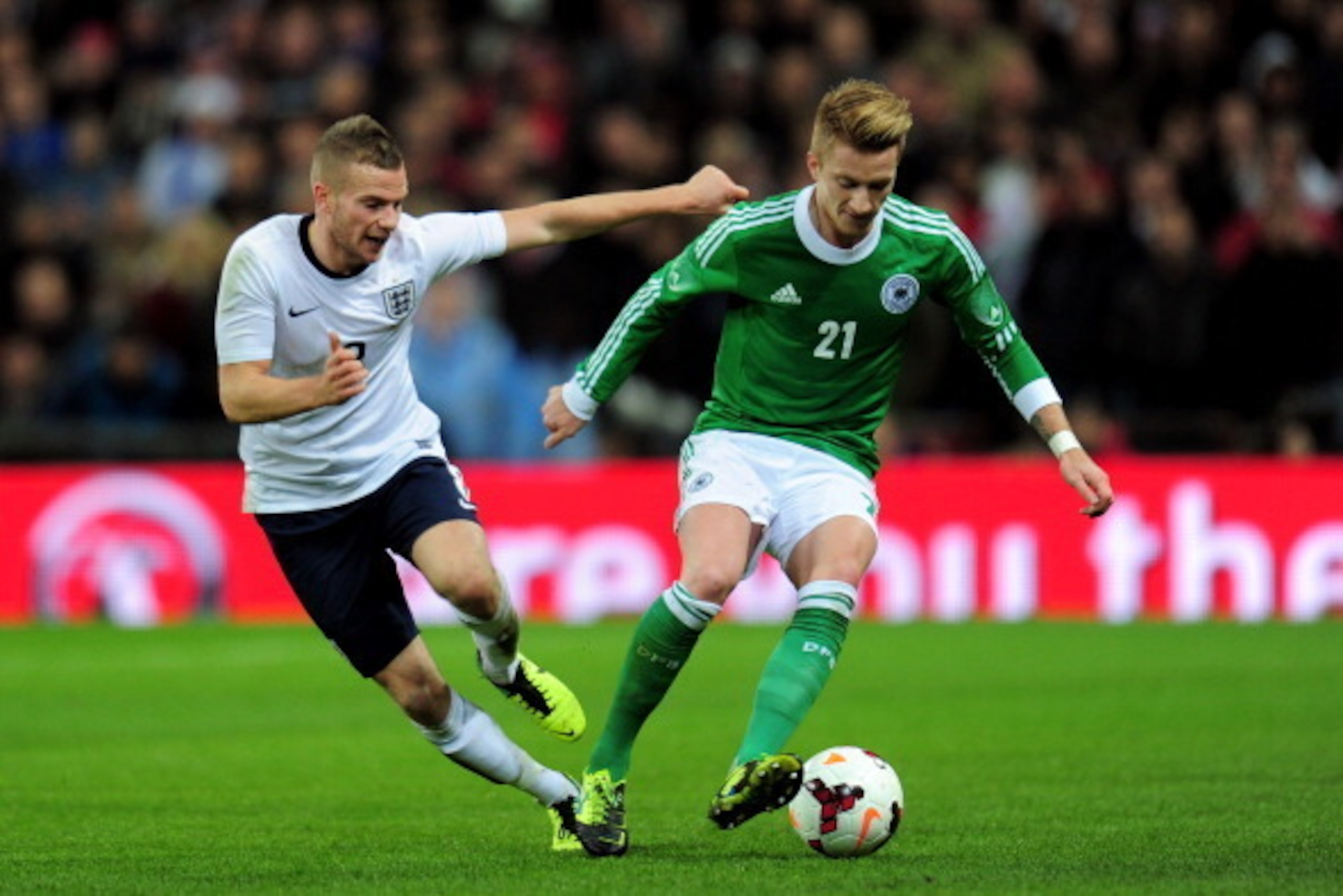 LONDON, ENGLAND - NOVEMBER 19:  Marco Reus of Germany beats Tom Cleverley of England during the international friendly match between England and Germany at Wembley Stadium on November 19, 2013 in London, England.  (Photo by Shaun Botterill/Getty Images)