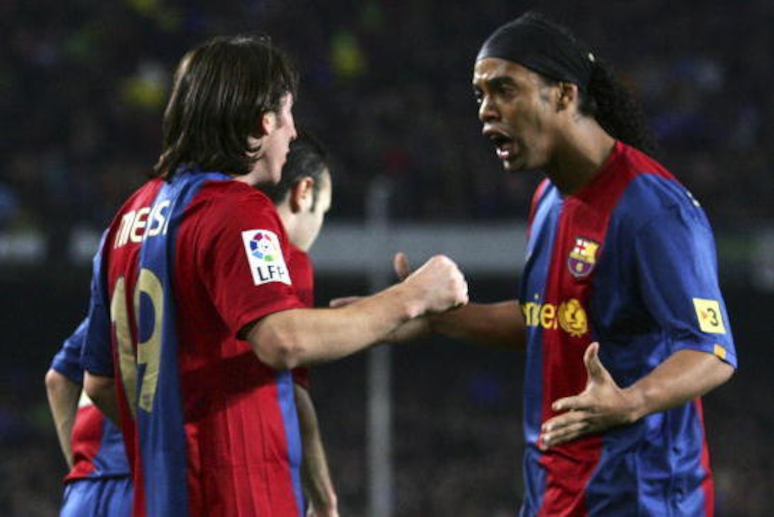 BARCELONA, SPAIN - MARCH 10:  Lionel Messi (L) of  Barcelona celebrates with Ronaldinho after scoring Barcelona's 2nd goal during the Primera Liga match between Barcelona and Real Madrid at the Nou Camp stadium on March 10, 2007 in Barcelona, Spain.   (Ph