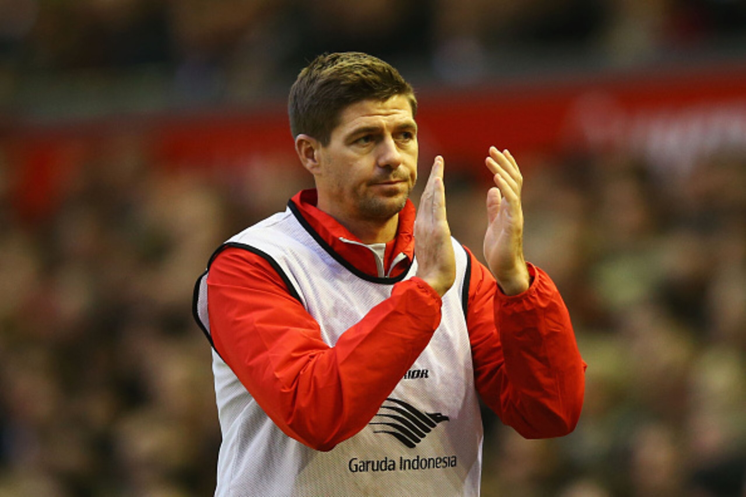 LIVERPOOL, ENGLAND - NOVEMBER 29:  Substitute Steven Gerrard of Liverpool applauds the crowd as he warms up during the Barclays Premier League match between Liverpool and Stoke City at Anfield on November 29, 2014 in Liverpool, England.  (Photo by Richard