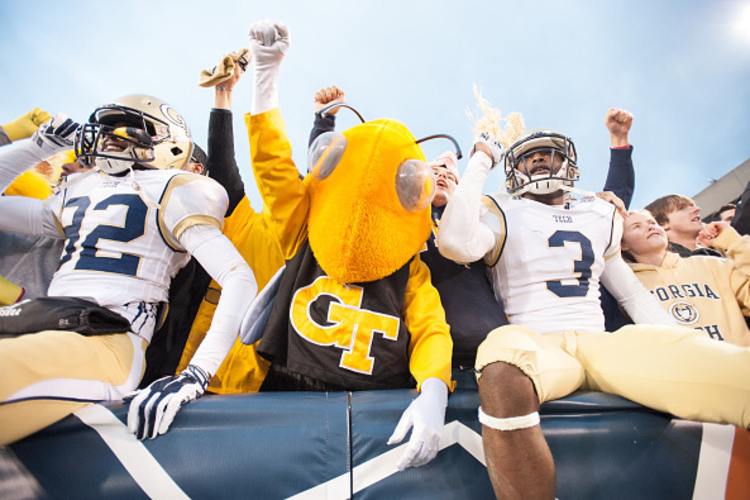 ATLANTA, GA - NOVEMBER 1: Linebacker Jabari Hunt-Days #32  and running back Dennis Andrews #3 of the Georgia Tech Yellow Jackets celebrates with their mascot Buzz on November 1, 2014 at Bobby Dodd Stadium in Atlanta, Georgia. The Georgia Tech Yellow Jacke