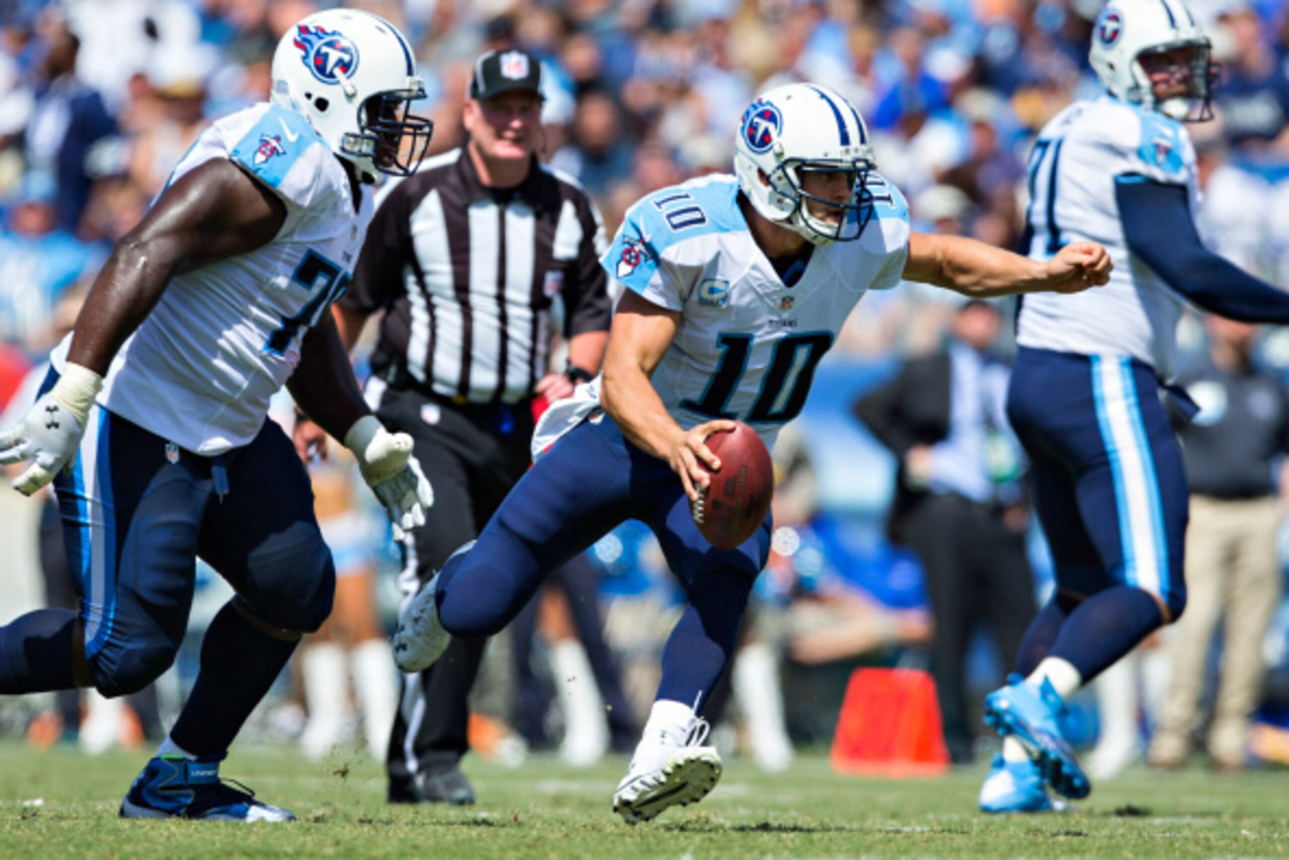NASHVILLE, TN - SEPTEMBER 14: Jake Locker #10 of the Tennessee Titans scrabbles with the ball against the Dallas Cowboys at LP Field on September 14, 2014 in Nashville, Tennessee. The Cowboys defeated the Titans 26-10. (Photo by Wesley Hitt/Getty Image NASHVILLE, TN - SEPTEMBER 14: Jake Locker #10 of the Tennessee Titans scrabbles with the ball against the Dallas Cowboys at LP Field on September 14, 2014 in Nashville, Tennessee. The Cowboys defeated the Titans 26-10. (Photo by Wesley Hitt/Getty Image