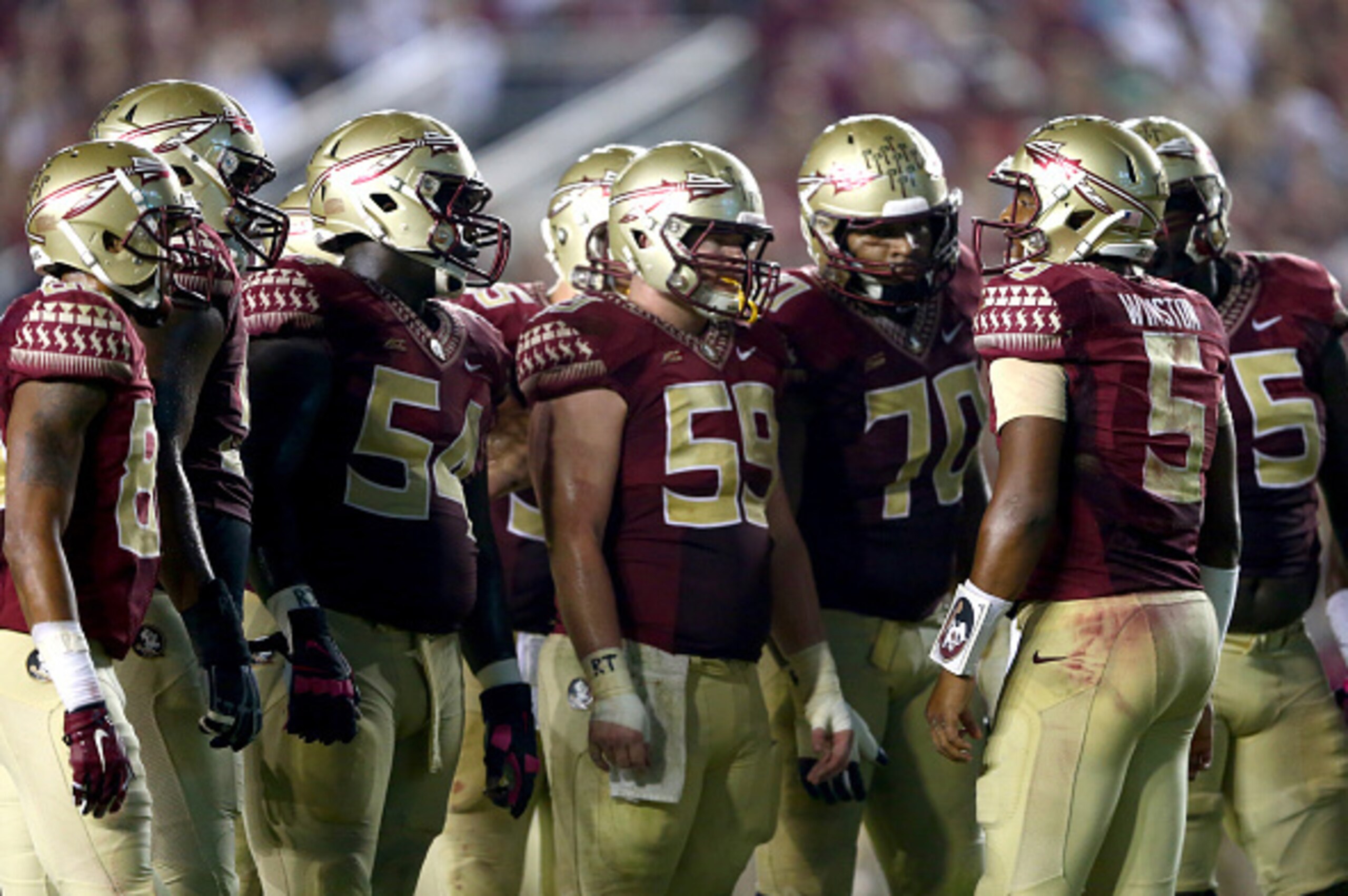TALLAHASSEE, FL - OCTOBER 18:  Jameis Winston #5 of the Florida State Seminoles in the huddle against the Notre Dame Fighting Irish during their game at Doak Campbell Stadium on October 18, 2014 in Tallahassee, Florida.  (Photo by Streeter Lecka/Getty Ima