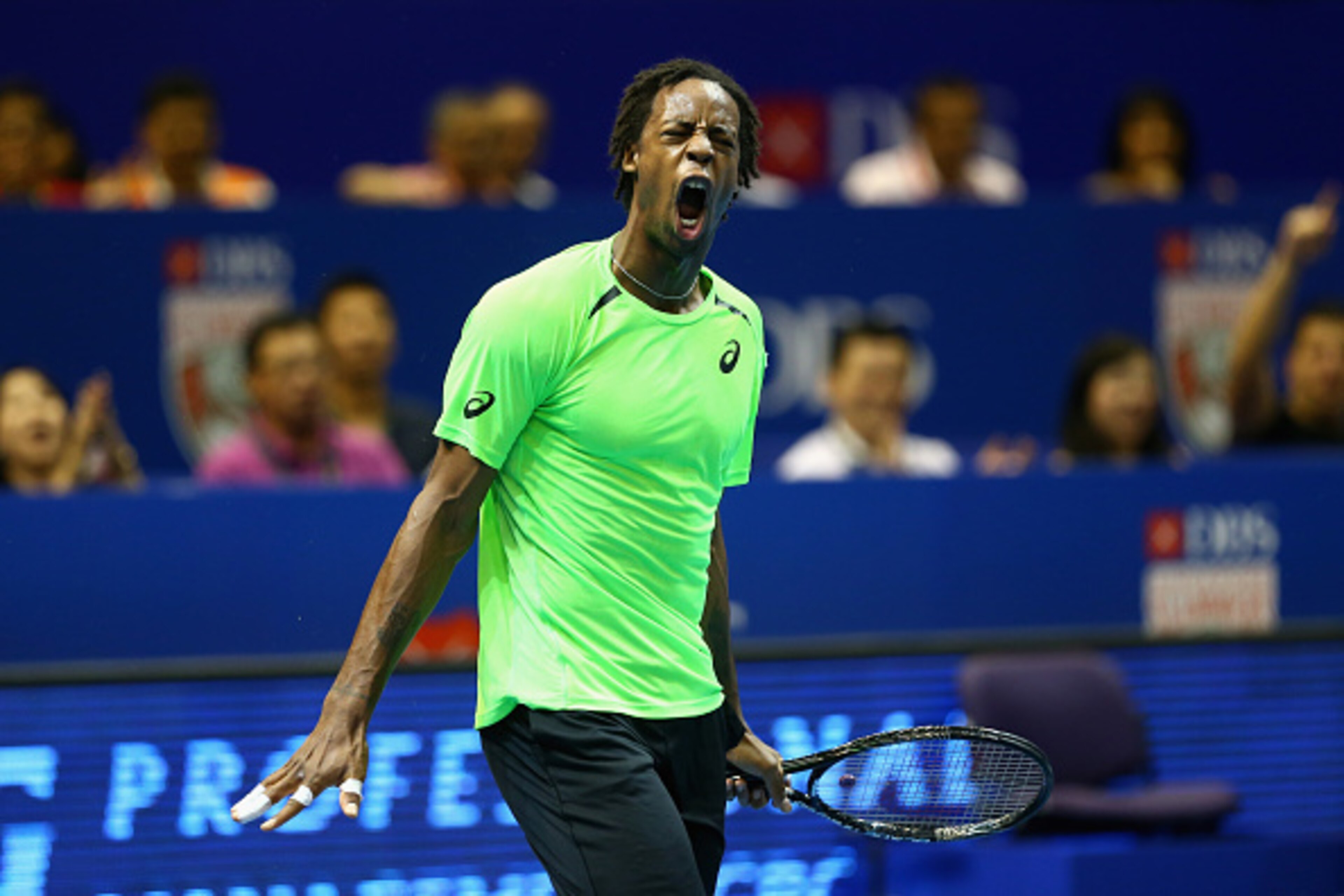 SINGAPORE - DECEMBER 03:  Gael Monfils of the Indian Aces celebrates a point against Tomas Berdych of the Singapore Slammers during the Coca-Cola International Premier Tennis League at the Singapore Sports Hub on December 3, 2014 in Singapore.  (Photo by 