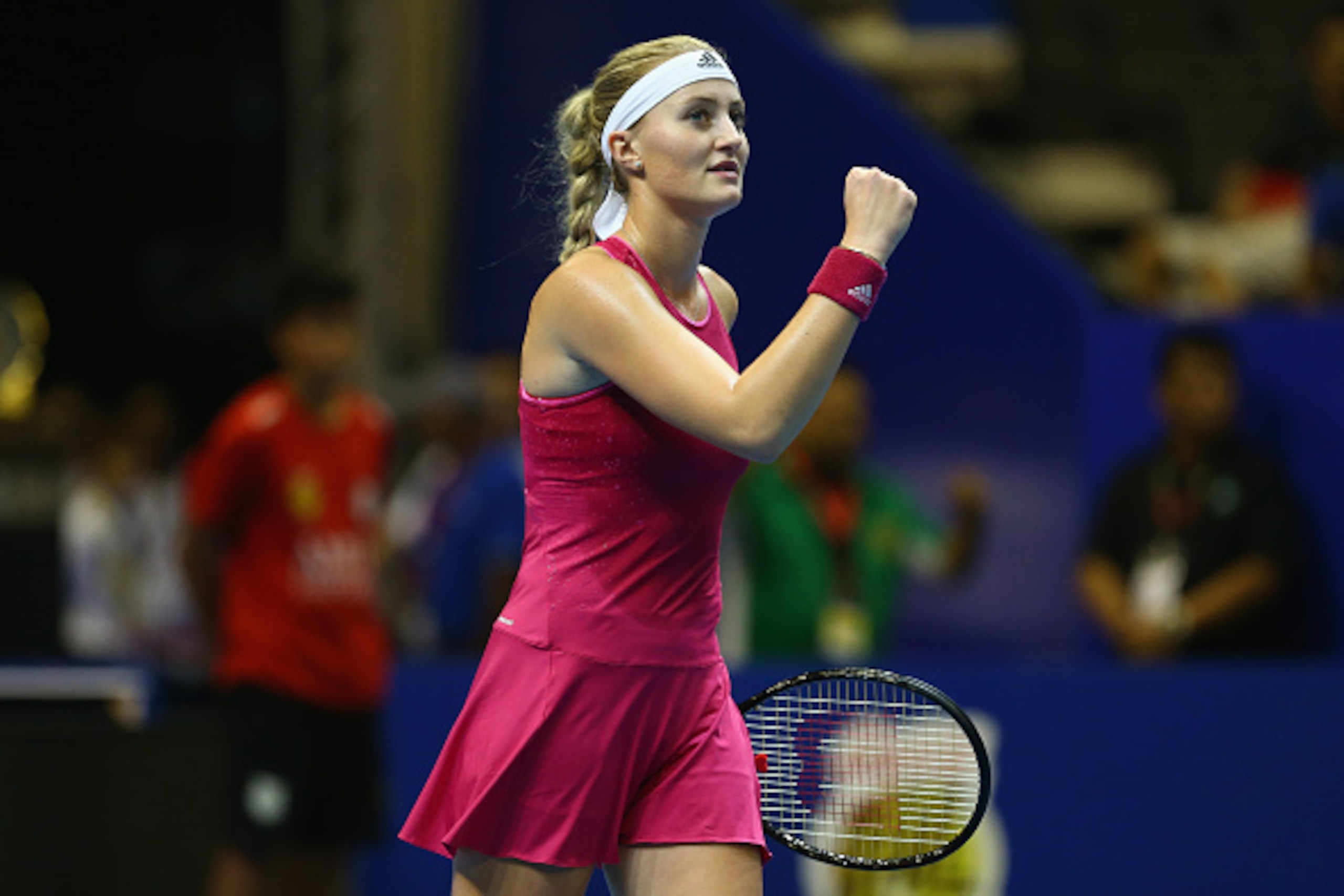 SINGAPORE - DECEMBER 03:  Kristina Mladenovic of the UAE Royals celebrates a point against Kirsten Flipkens of the Manila Mavericks during the Coca-Cola International Premier Tennis League at the Singapore Sports Hub on December 3, 2014 in Singapore.  (Ph