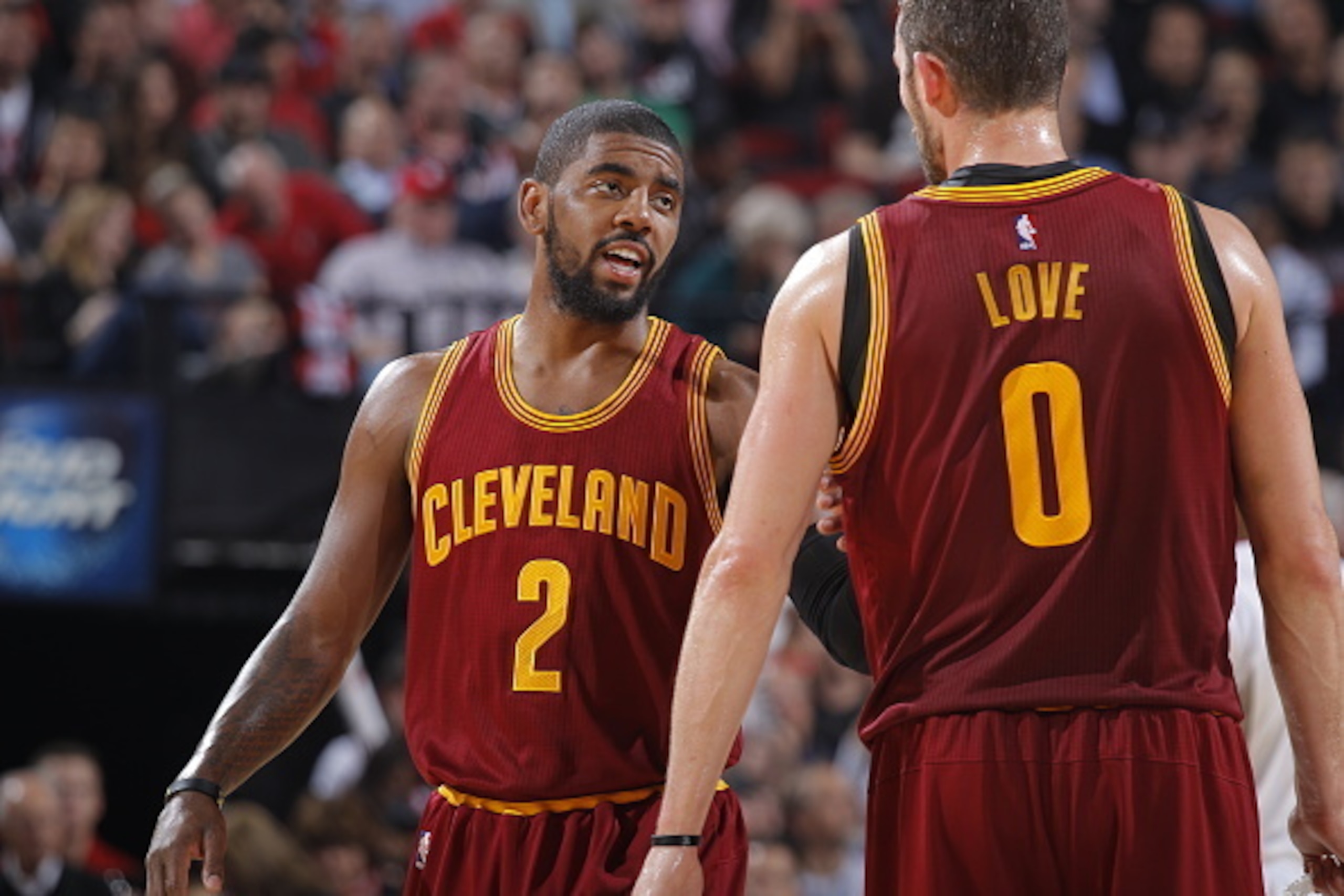 PORTLAND, OR - NOVEMBER 4:  Kyrie Irving #2 of the Cleveland Cavaliers talks with teammate Kevin Love #0 during the game against the Portland Trail Blazers on November 4, 2014 at the Moda Center in Portland, Oregon. NOTE TO USER: User expressly acknowledg