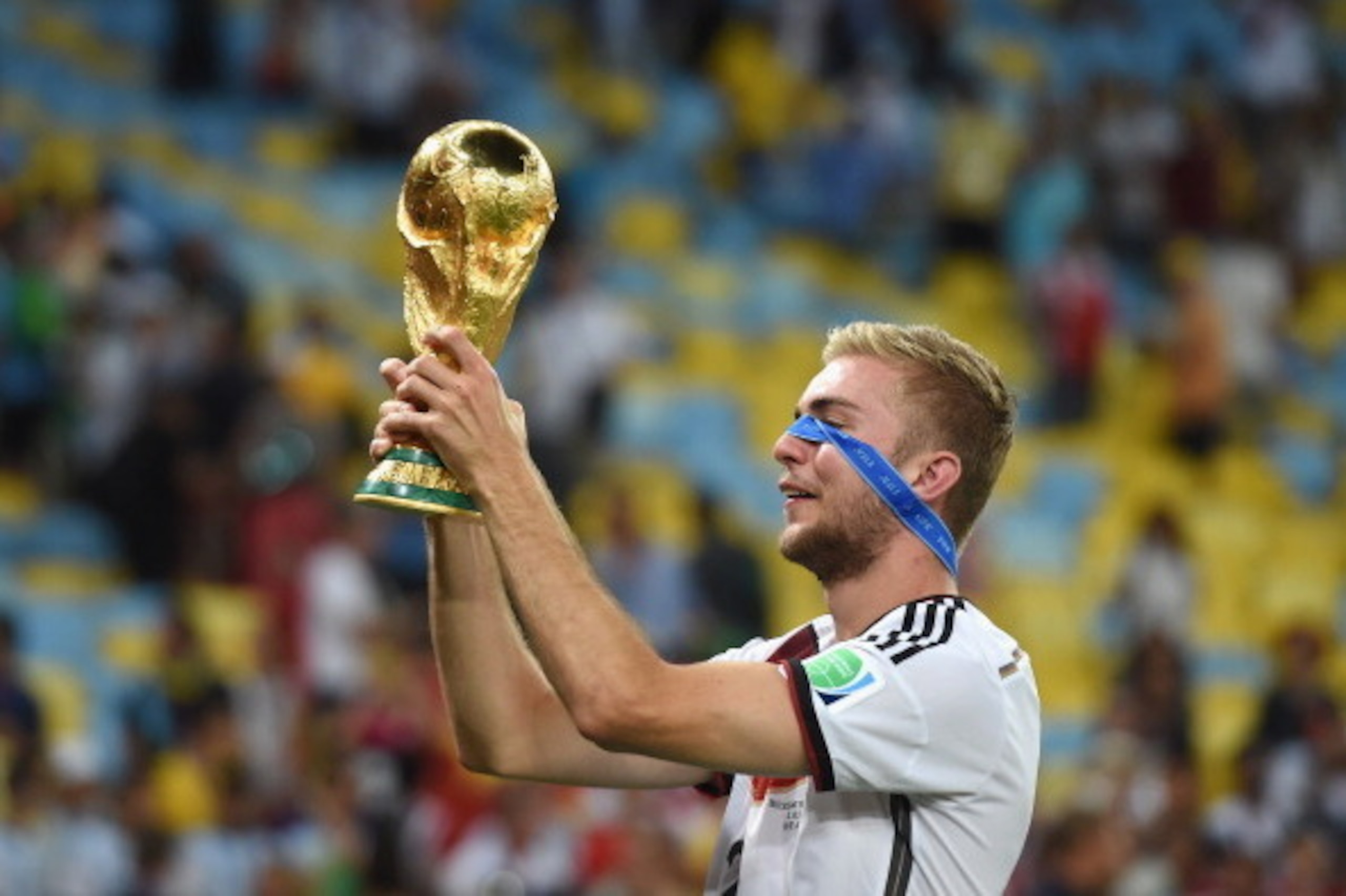 RIO DE JANEIRO, BRAZIL - JULY 13: Christoph Kramer of Germany celebrates with the World Cup trophy after defeating Argentina 1-0 in extra time during the 2014 FIFA World Cup Brazil Final match between Germany and Argentina at Maracana on July 13, 2014 in RIO DE JANEIRO, BRAZIL - JULY 13: Christoph Kramer of Germany celebrates with the World Cup trophy after defeating Argentina 1-0 in extra time during the 2014 FIFA World Cup Brazil Final match between Germany and Argentina at Maracana on July 13, 2014 in