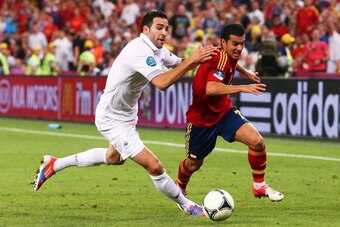 DONETSK, UKRAINE - JUNE 23:  Adil Rami of France battles with Pedro of Spain during the UEFA EURO 2012 quarter final match between Spain and France at Donbass Arena on June 23, 2012 in Donetsk, Ukraine.  (Photo by Alex Livesey/Getty Images)