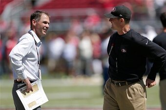 Harbaugh and Baalke staying their court-mandated four feet away from each other.