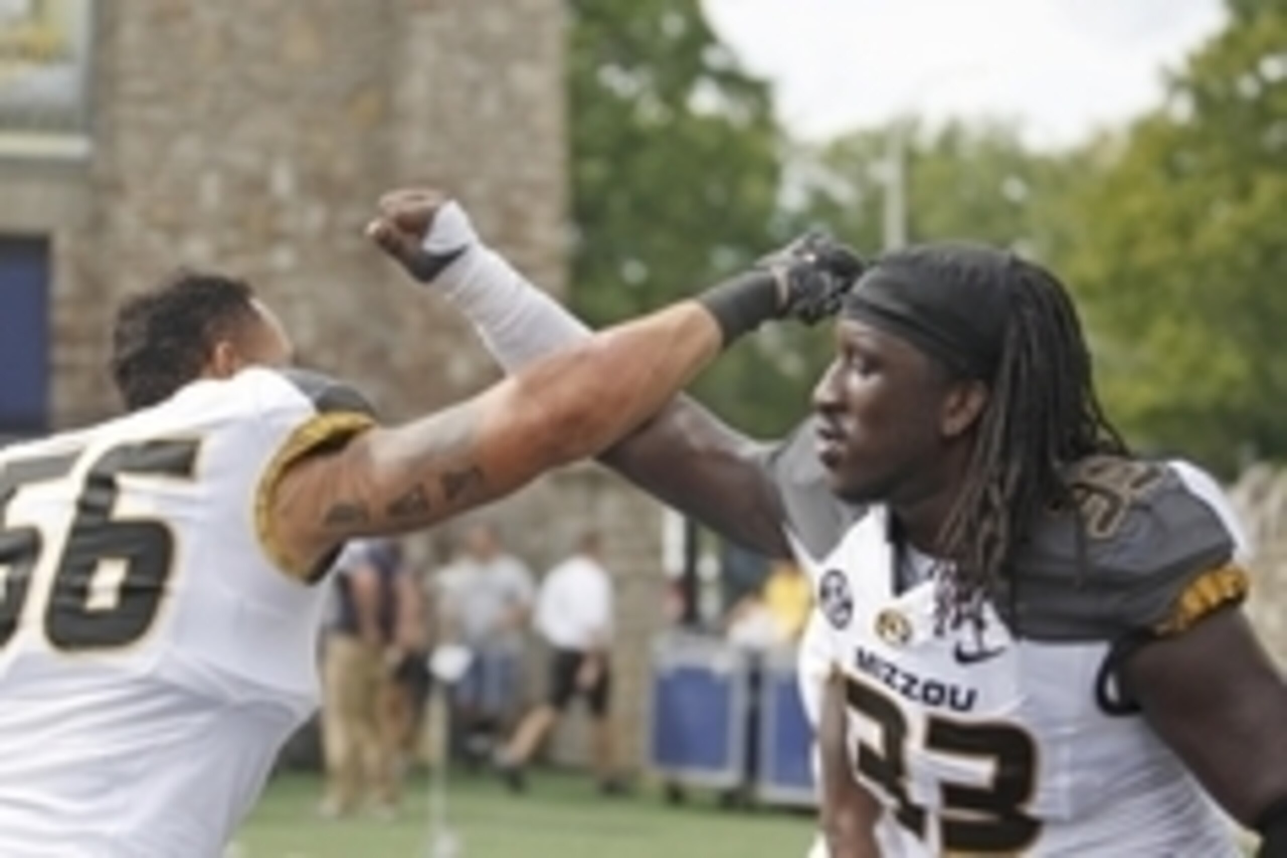 Sep 6, 2014; Toledo, OH, USA; Missouri Tigers defensive lineman Shane Ray (56) and defensive lineman Markus Golden (33) celebrate after the game against the Toledo Rockets at Glass Bowl. Tigers beat the Rockets 49-24. Mandatory Credit: Raj Mehta-USA TODAY