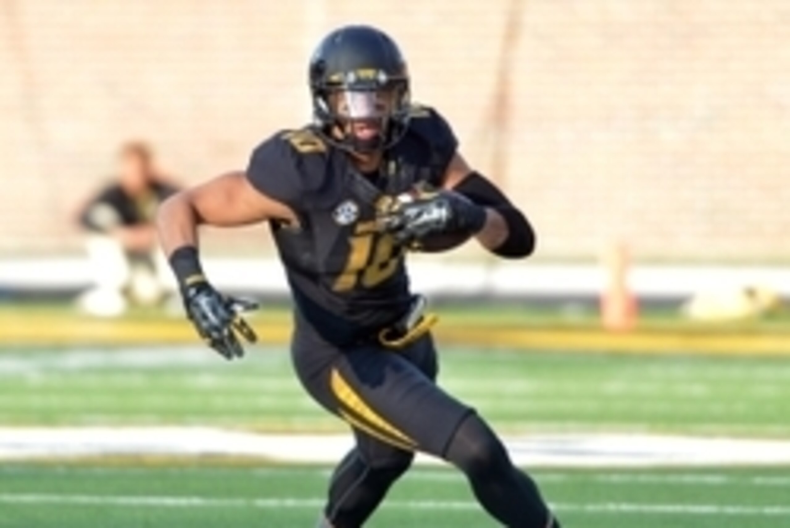 Nov 28, 2014; Columbia, MO, USA; Missouri Tigers tight end Jason Reese (10) runs the ball during the second half against the Arkansas Razorbacks at Faurot Field. Missouri won 21-14. Mandatory Credit: Denny Medley-USA TODAY Sports