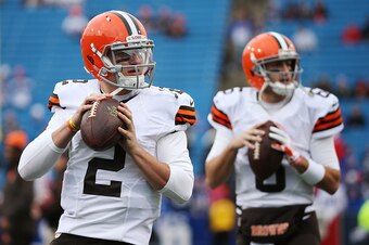 ORCHARD PARK, NY - NOVEMBER 30:   Johnny Manziel #2 of the Cleveland Browns and Brian Hoyer #6 of the Cleveland Browns warm up before the game against the Buffalo Bills at Ralph Wilson Stadium on November 30, 2014 in Orchard Park, New York.  (Photo by Bre
