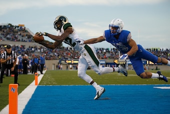 COLORADO SPRINGS, CO - NOVEMBER 28: Wide receiver Rashard Higgins #82 of the Colorado State Rams makes a catch for a touchdown while being defended by defensive back Justin DeCoud #13 of the Air Force Falcons during the fourth quarter at Falcon Stadium on