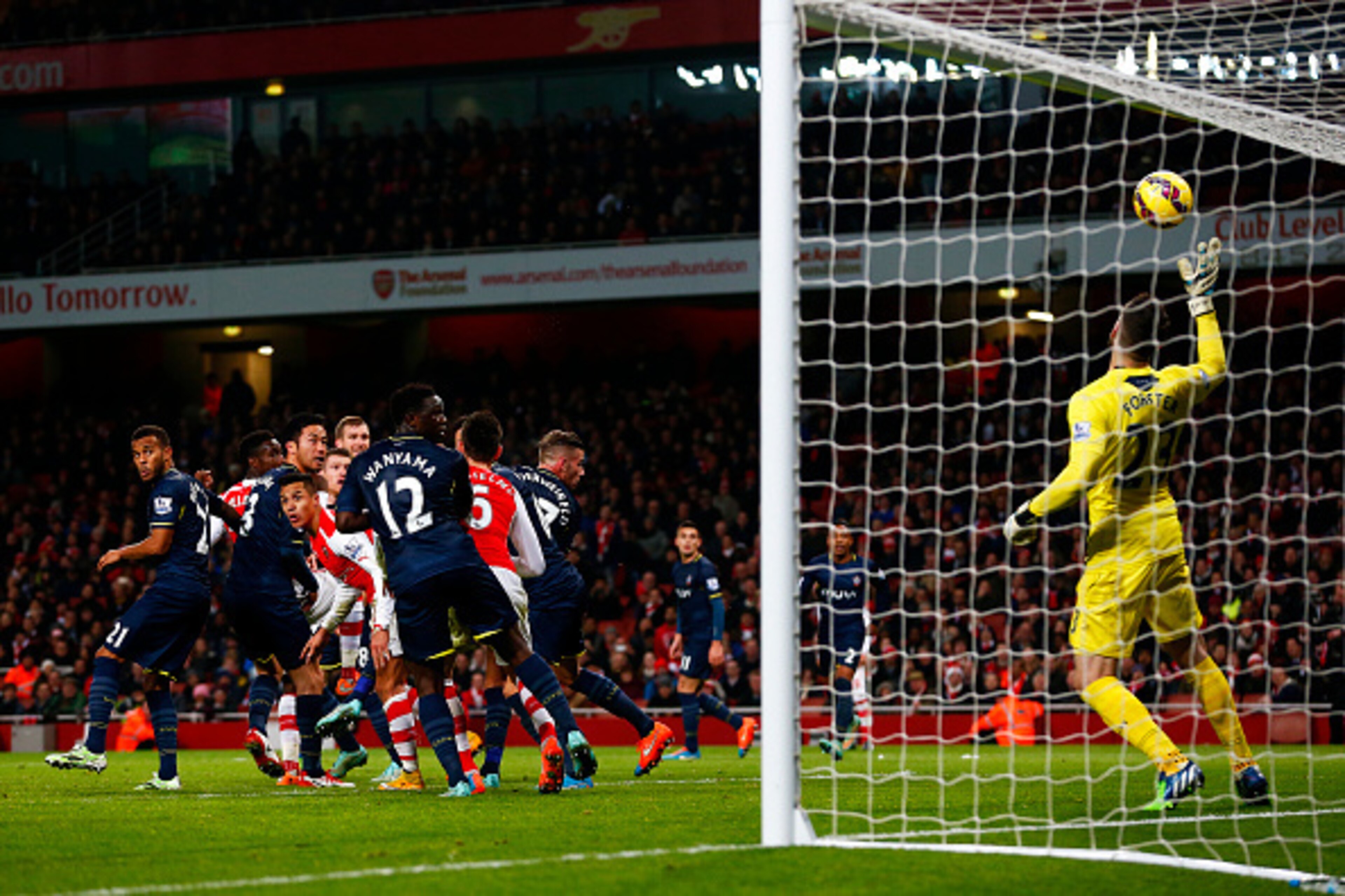 LONDON, ENGLAND - DECEMBER 03:  Fraser Forster of Southampton makes a save during the Barclays Premier League match between Arsenal and Southampton at Emirates Stadium on December 3, 2014 in London, England.  (Photo by Julian Finney/Getty Images)