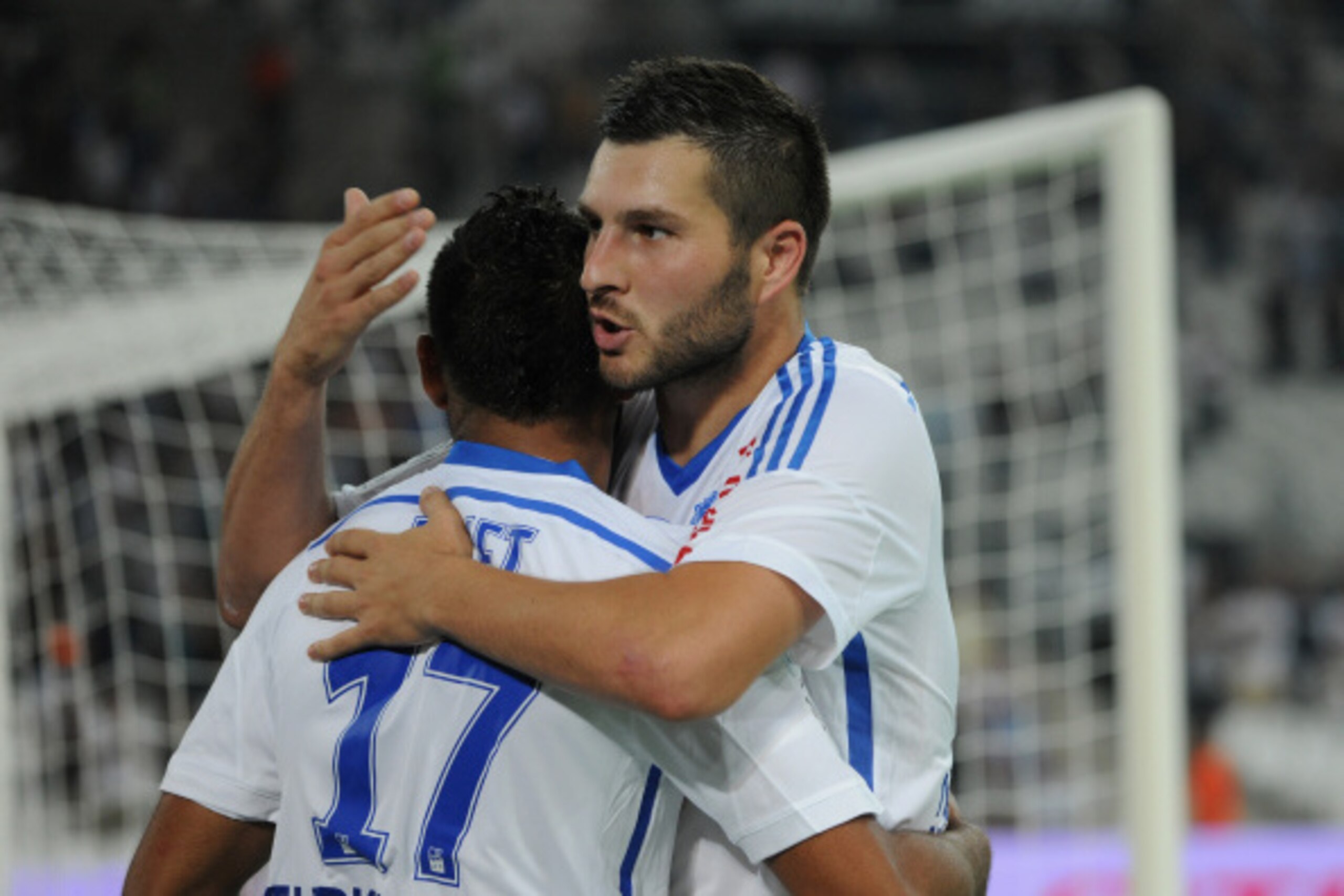 MARSEILLE, FRANCE - AUGUST 29:  Dimitri Payet (L) of Marseille is congratulated by his teammate Andre-Pierre Gignac for the team's third goal during the French Ligue 1 match between Olympique de Marseille and OGC Nice at Stade Velodrome on August 29, 2014