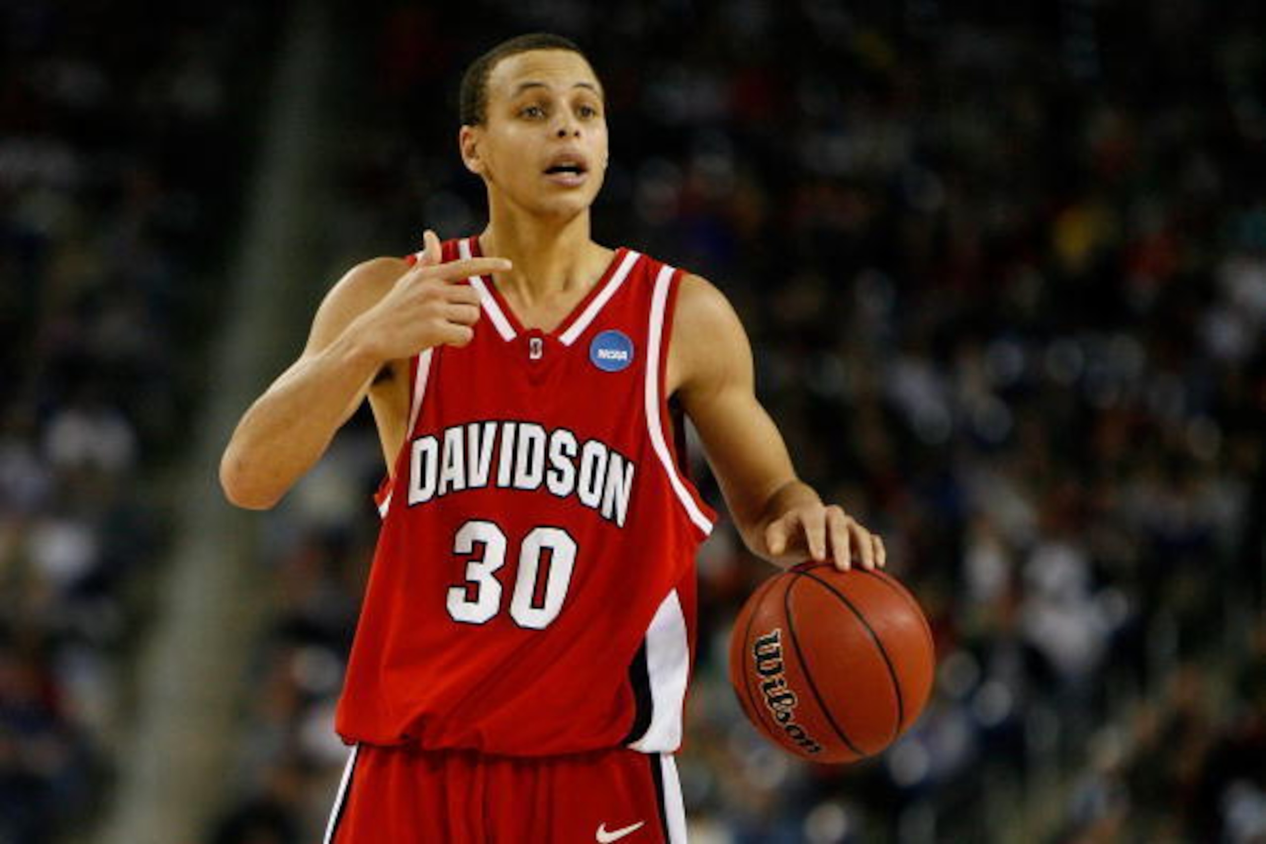 DETROIT - MARCH 30:  Stephen Curry #30 of the Davidson Wildcats directs the offense against the Kansas Jayhawks during the Midwest Regional Final of the 2008 NCAA Division I Men's Basketball Tournament at Ford Field on March 30, 2008 in Detroit, Michigan.