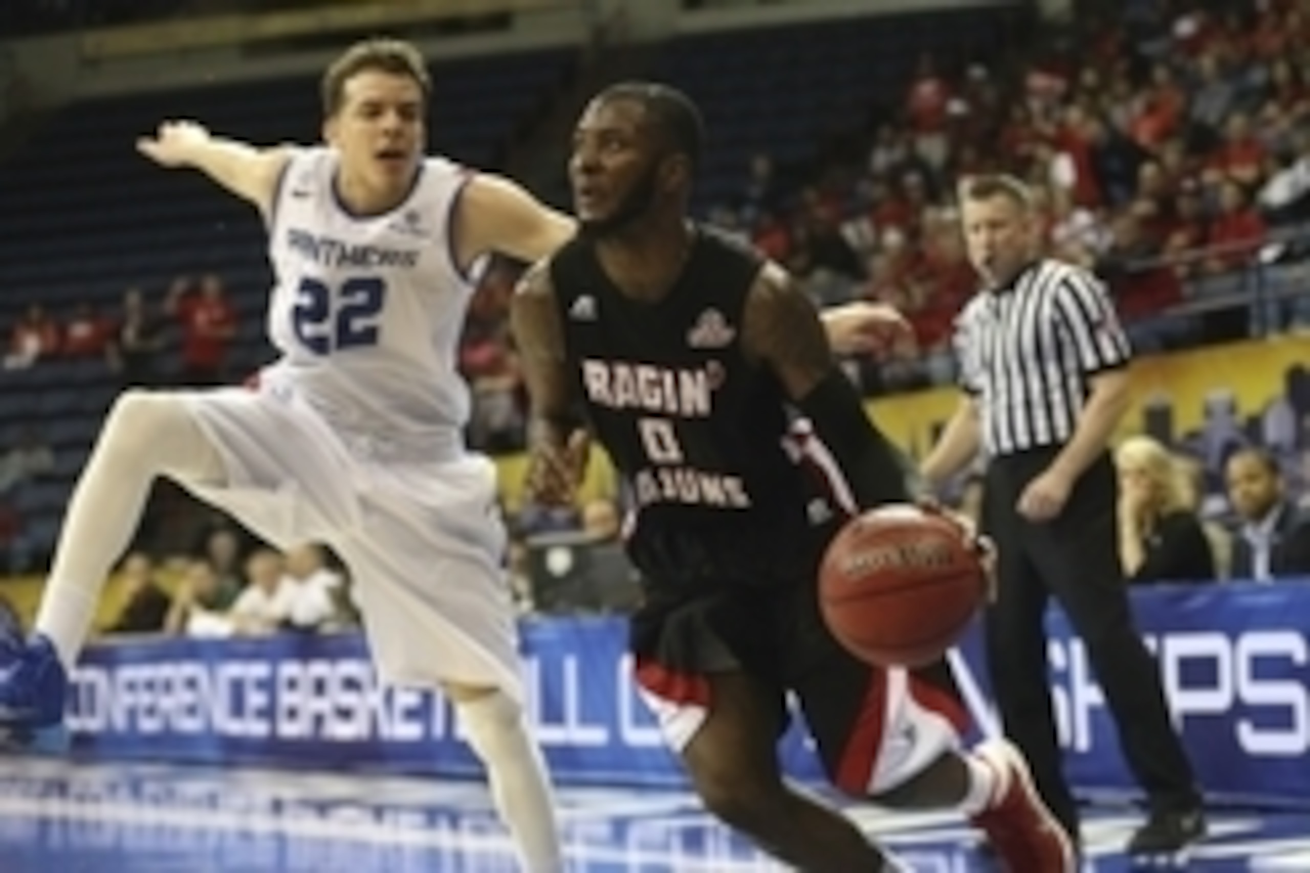 Mar 16, 2014; New Orleans, LA, USA; Louisiana Lafayette Ragin Cajuns guard Bryant Mbamalu (0) drives the ball toward the basket in front of Georgia State Panthers guard R.J. Hunter (22) in the first half in the championship game of the Sun Belt Conference