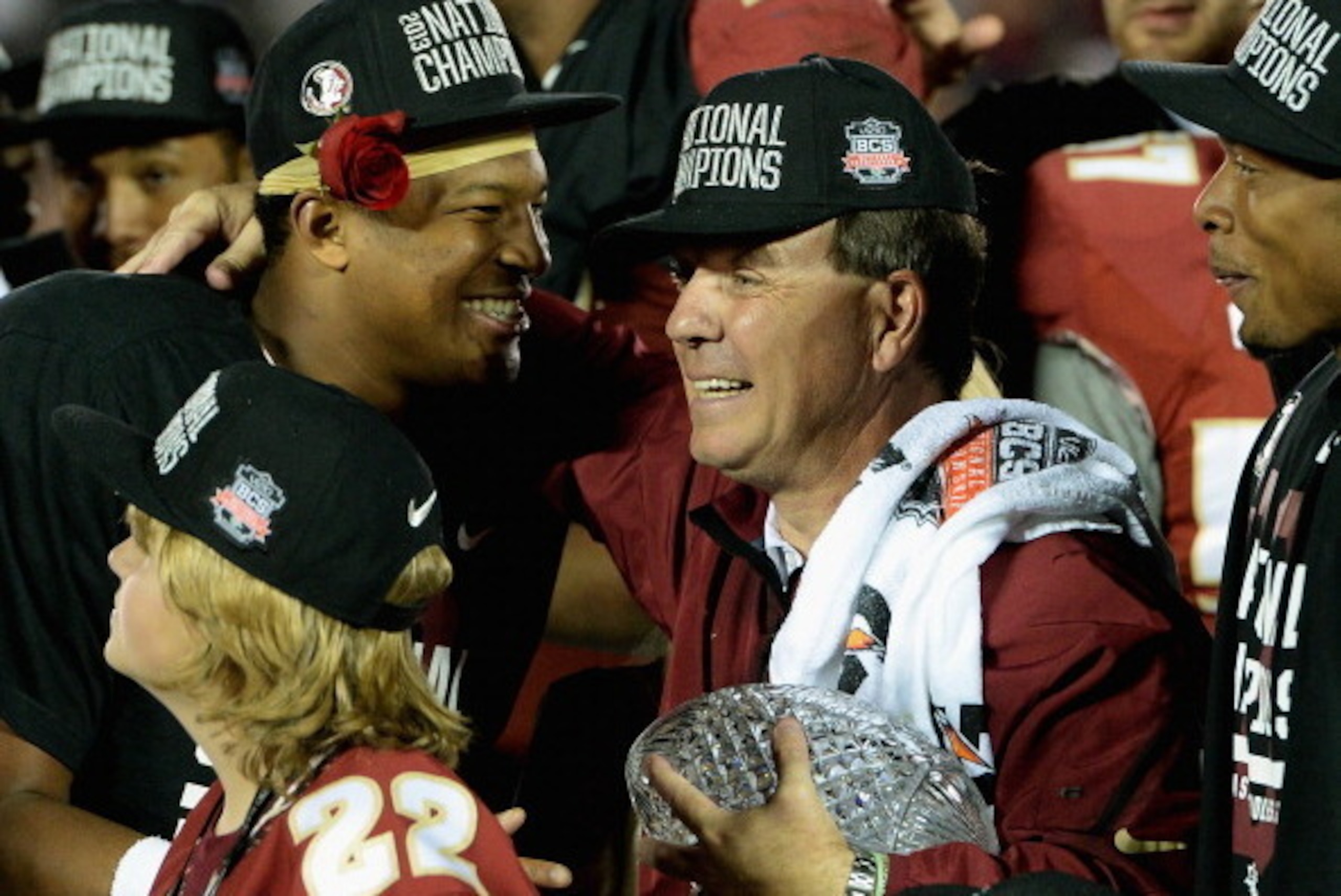 PASADENA, CA - JANUARY 06:  Florida State Seminoles head coach Jimbo Fisher (R) holds the Coaches' Trophy as quarterback Jameis Winston (L) #5 looks on after defeating the Auburn Tigers 34-31 in the 2014 Vizio BCS National Championship Game at the Rose Bo