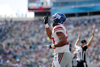 JACKSONVILLE, FL - NOVEMBER 30: Rashad Jennings #23 of the New York Giants reacts after scoring a touchdown during the first half of the game against the Jacksonville Jaguars at EverBank Field on November 30, 2014 in Jacksonville, Florida.  (Photo by Rob 