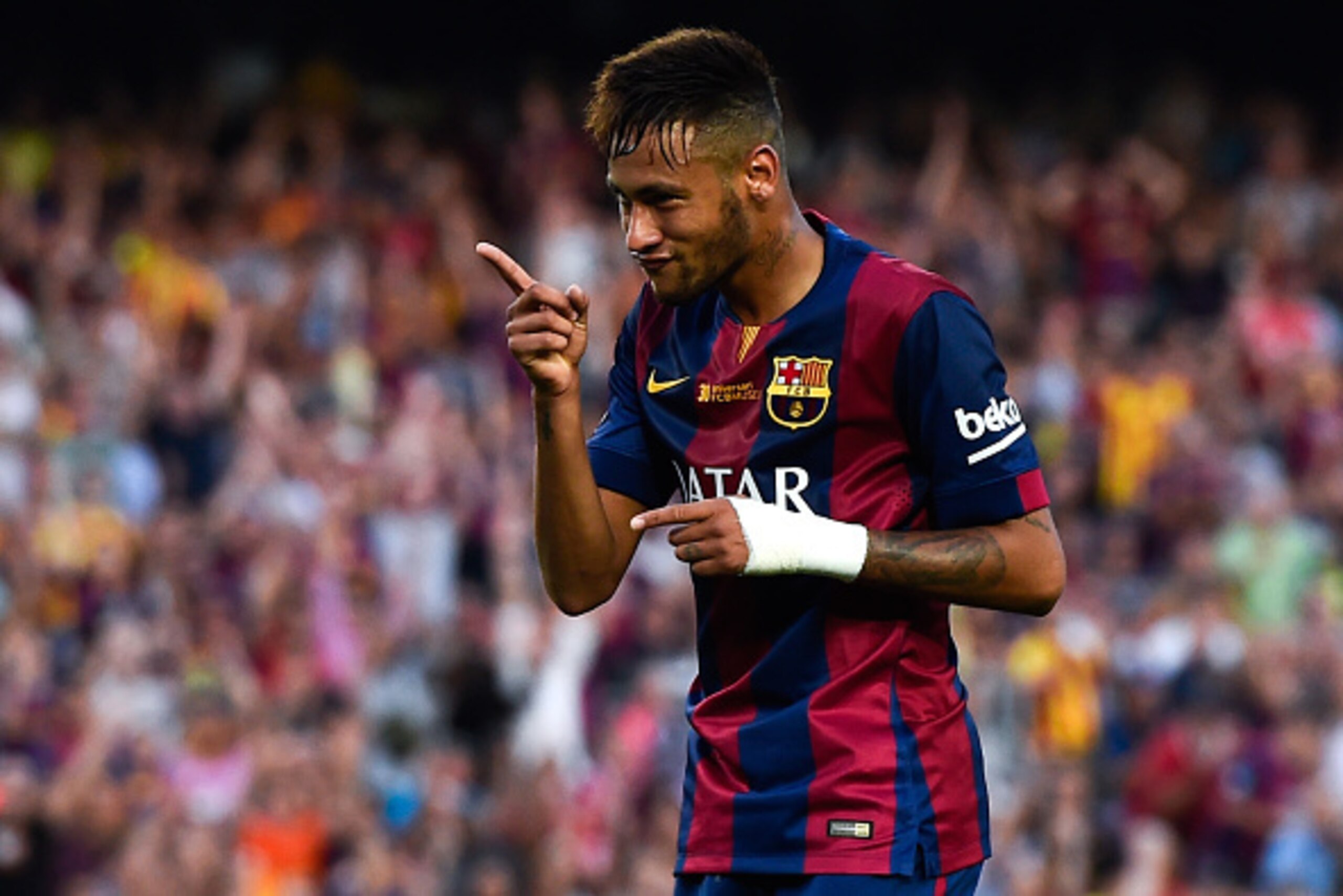 BARCELONA, SPAIN - SEPTEMBER 27:  Neymar of FC Barcelona celebrates after scoring his team's fifth goal during the La Liga match between FC Barcelona and Granada CF at Camp Nou on September 27, 2014 in Barcelona, Spain.  (Photo by David Ramos/Getty Images